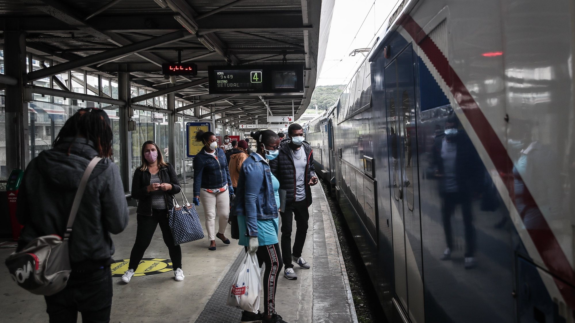 People wait to get on a Fertagus train at Sete Rios station, Portugal, 4 May 2020. Portugal is in a calamity after three consecutive periods in a state of emergency. In this new period, the use of masks on public transport will be mandatory. MÁRIO CRUZ/LUSA