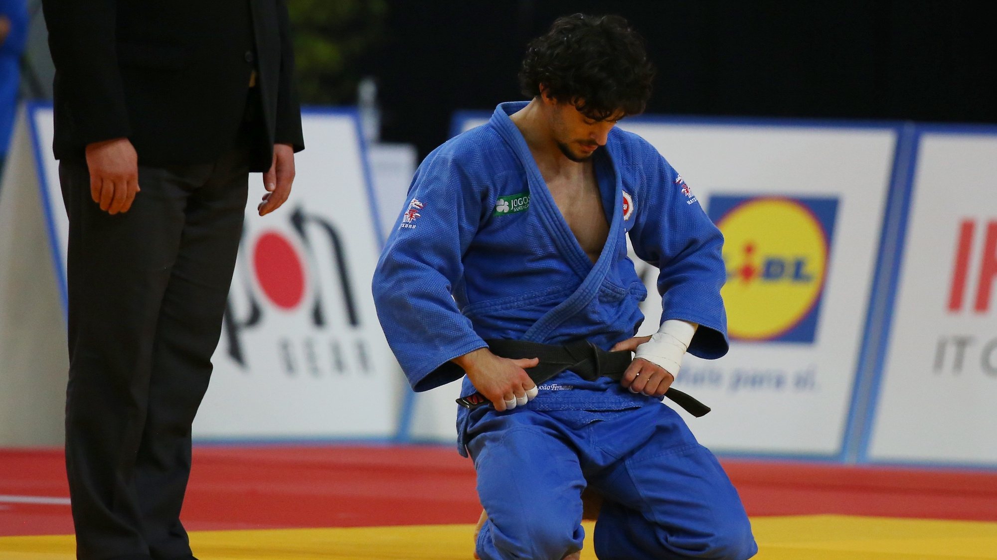 João Fernando of Portugal (blue) reacts after his elimination in the men&#039;s -73kg category at the European Judo Championships in Lisbon, Portugal, 17 April 2021. NUNO VEIGA/LUSA