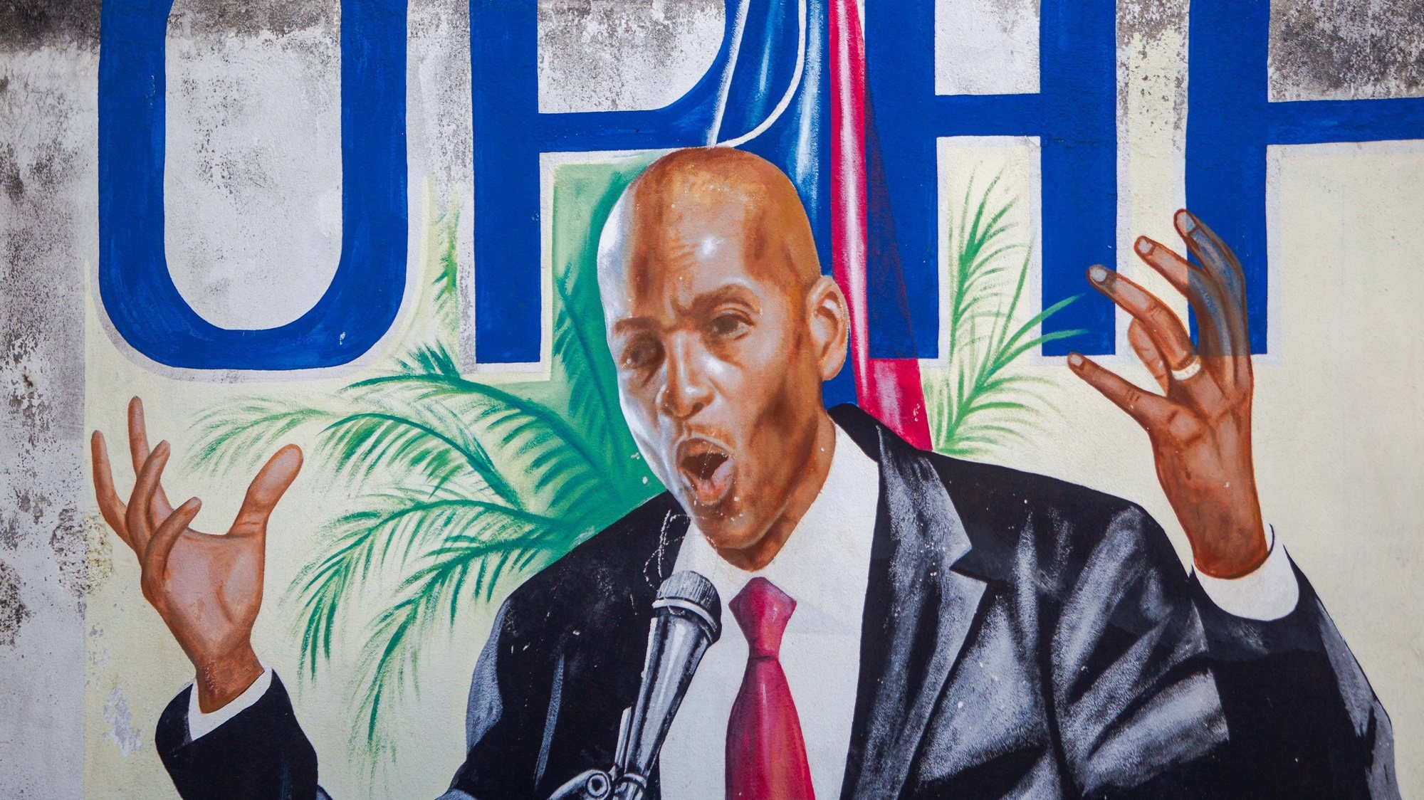 epa09329349 View of a mural of the assassinated President Jovenel Moise in Port-au-Prince, Haiti, 07 July 2021. The President of Haiti Jovenel Moise, was assassinated on 07 July by armed men who carried out an attack on his residence in the early morning in the Pelerin neighborhood of Port-au-Prince, said interim prime minister, Claude Joseph.  EPA/JEAN MARC HERVE ABELARD