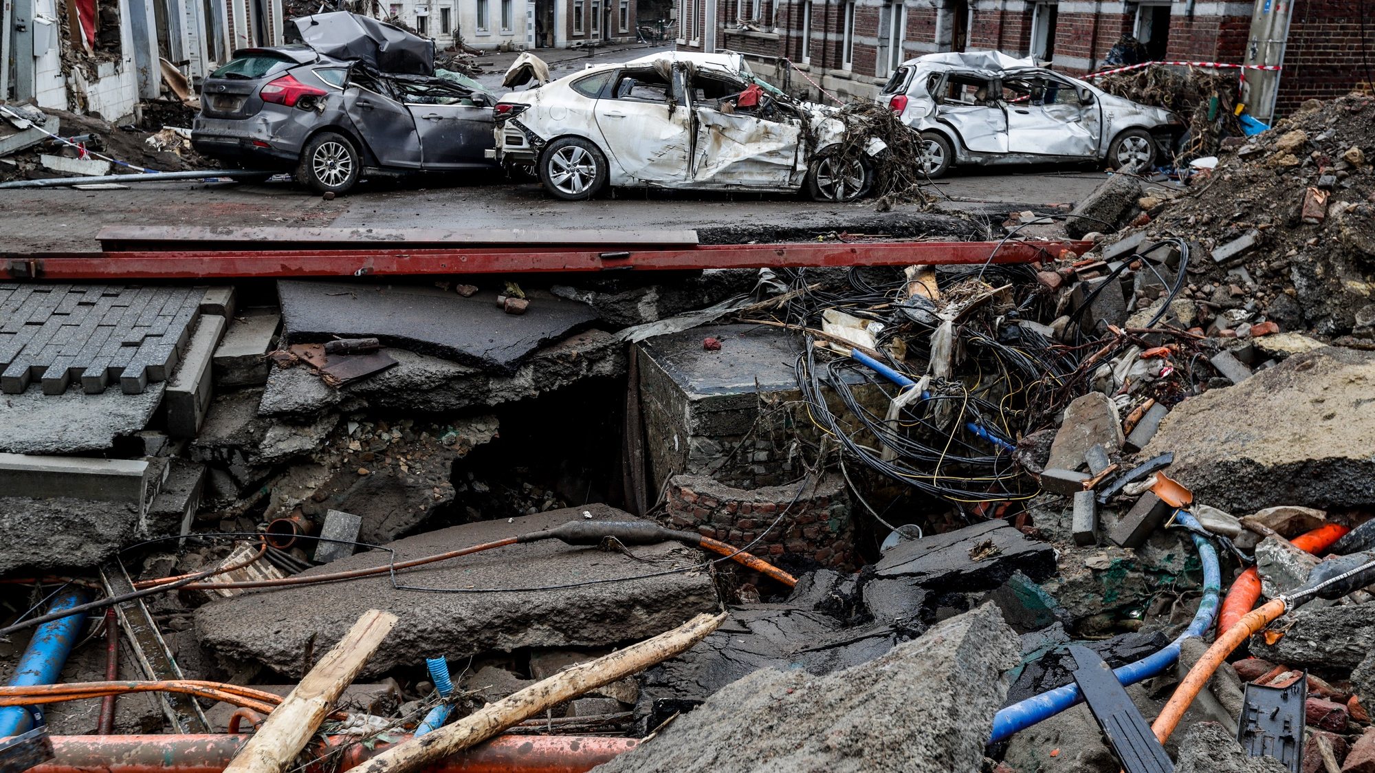 epaselect epa09362387 A view of damaged cars in Pepinster, Belgium, 24 July 2021. Heavy rains caused widespread damage and flooding in parts of Belgium and across central Europe in the night of 14/15 July. Dozens have died and many remain unaccounted for.  EPA/STEPHANIE LECOCQ