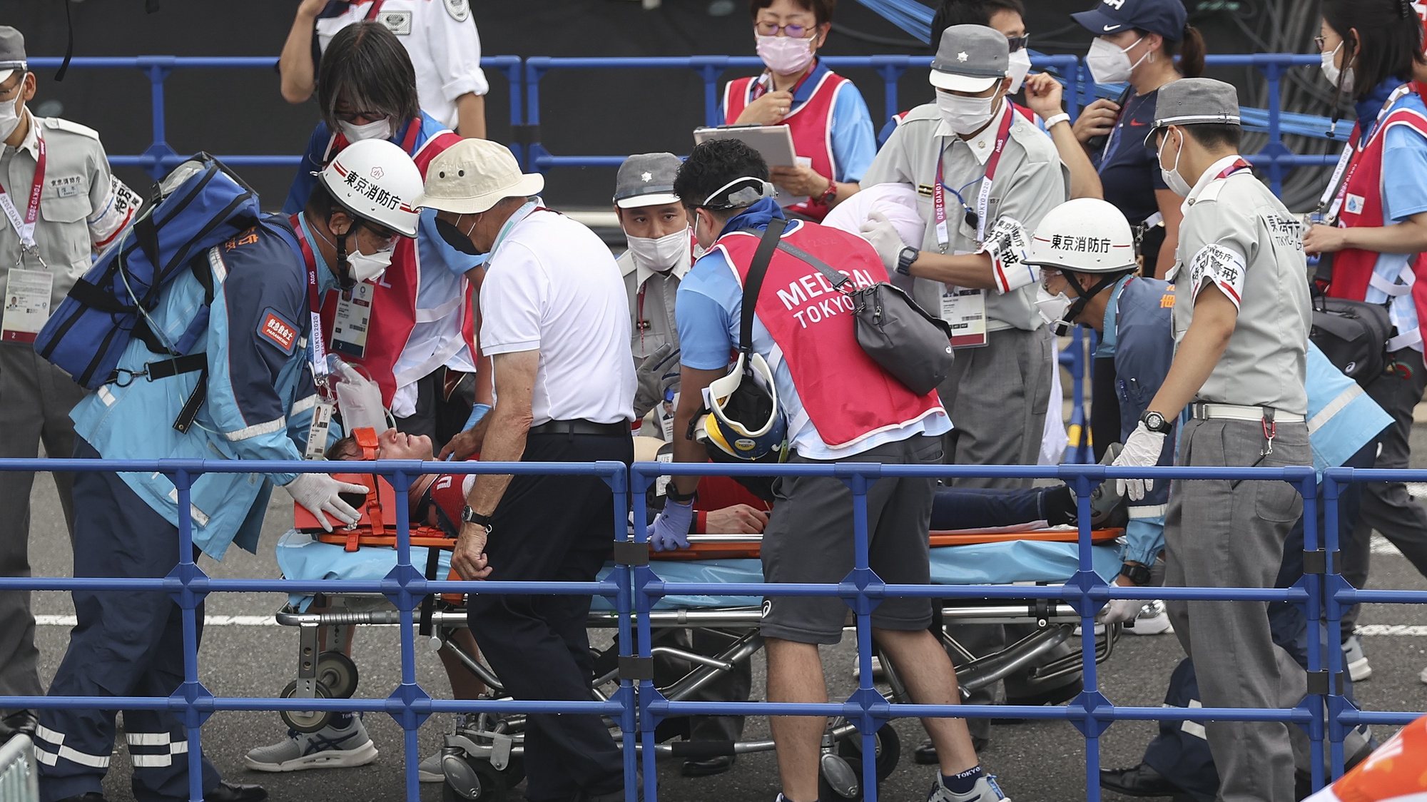 epa09378670 Connor Fields (C) of USA receives medical attention after crashing at the Men&#039;s Cycling BMX Racing semifinal during the Cycling BMX Racing events of the Tokyo 2020 Olympic Games at the Ariake Urban Sports Park in Tokyo, Japan, 30 July 2021.  EPA/FAZRY ISMAIL