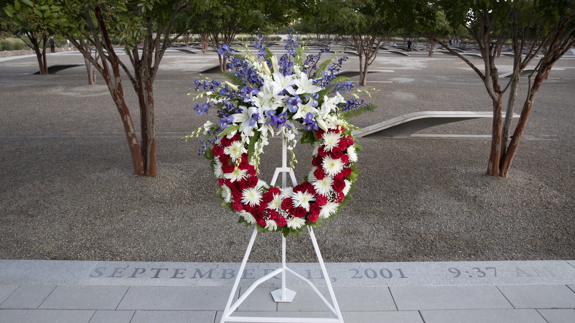 epa09460936 A wreath is placed at the National 9/11 Pentagon Memorial, before an observance ceremony for the 20th anniversary of the 9/11 attacks, at the Pentagon in Arlington, Virginia, USA, 11 September 2021. The 20th anniversary of the worst terrorist attack on US soil is being observed at various locations throughout the world.  EPA/MICHAEL REYNOLDS