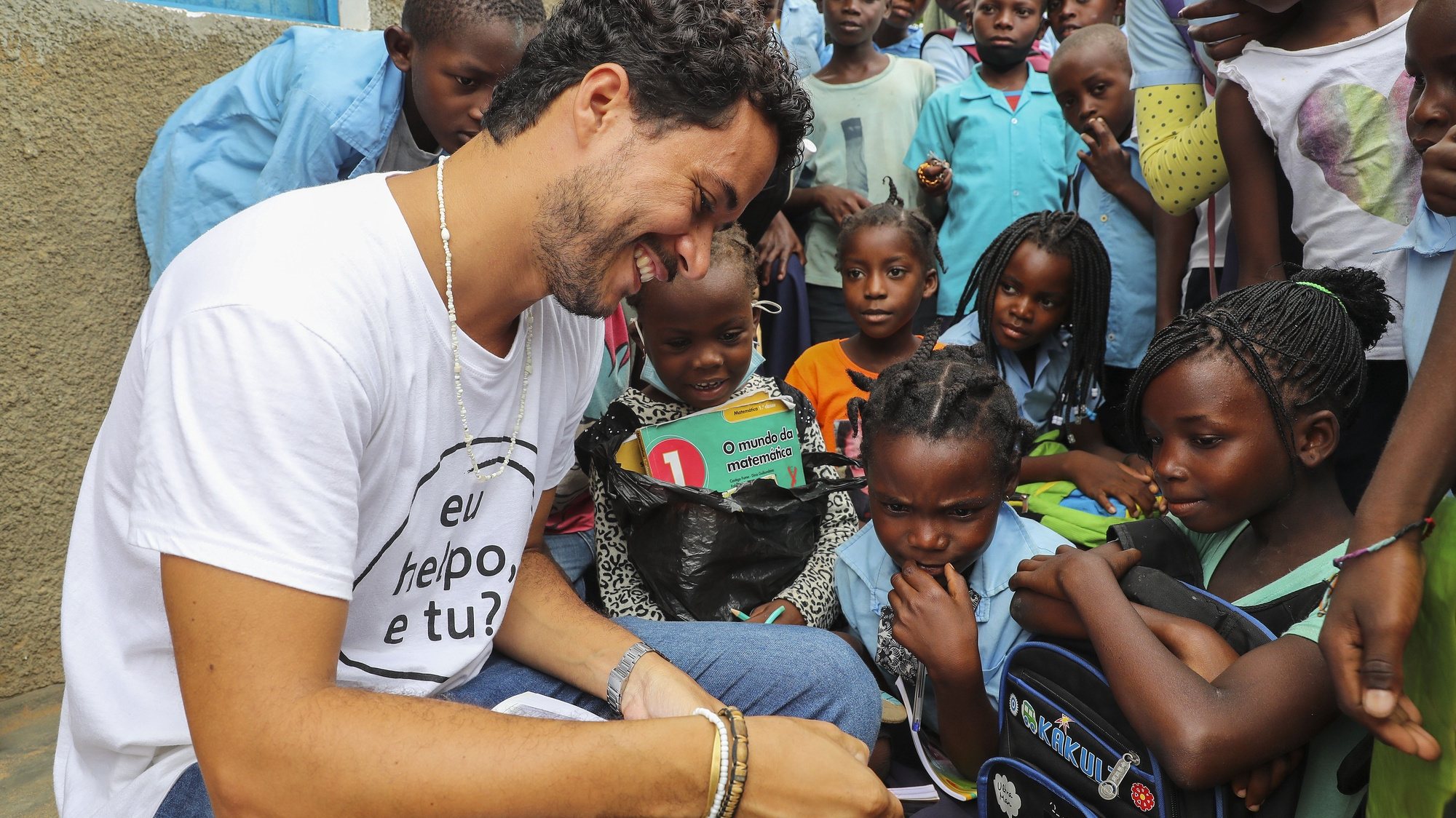 Leandro Martins, 31 years old Brazilian and Karibu project manager, talks to some of the students during the break. The NGO Helpo, through the Karibu project, supports 500 displaced students from the 2000s who are studying at the primary school in the Mahate neighborhood, in Pemba, Cabo Delgado province, April 14, 2021. The violence unleashed more than three years ago in Cabo Delgado province escalated again about two weeks ago, when armed groups first attacked the town of Palma, forcing people to flee from a conflict zone. JOAO RELVAS/LUSA
