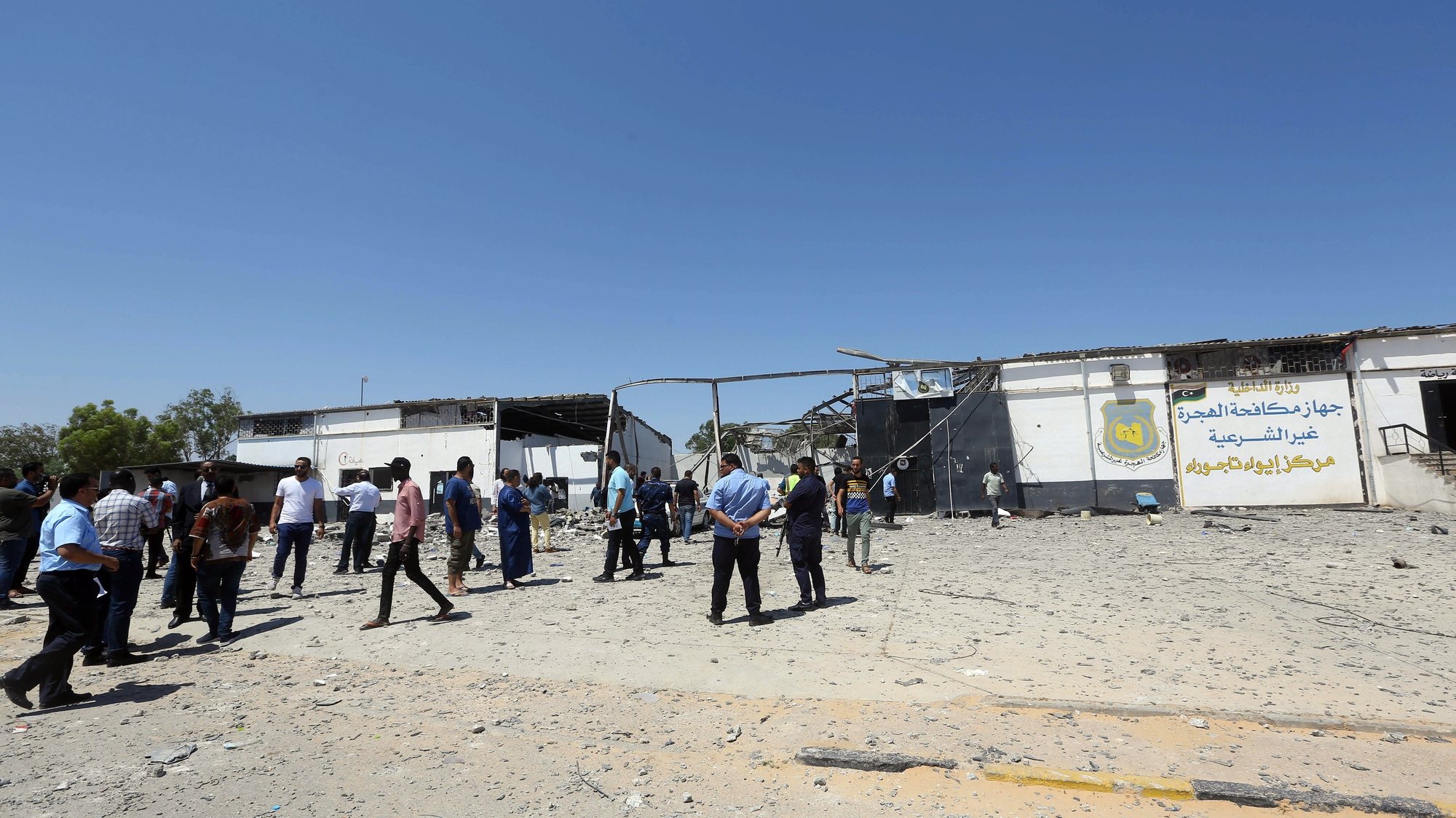 epa07692754 Migrants check the rubble of a destroyed detention center in Tripoli&#039;s, Libya, 03 July 2019. according to media reports, At least 44 people killed and 130 were injured after strike hit the Tajoura detention center held at least 600 refugees were attempting to reach Europe from Libya. The parties disputed didn&#039;t claimed any responsibility for the attack.  EPA/STR