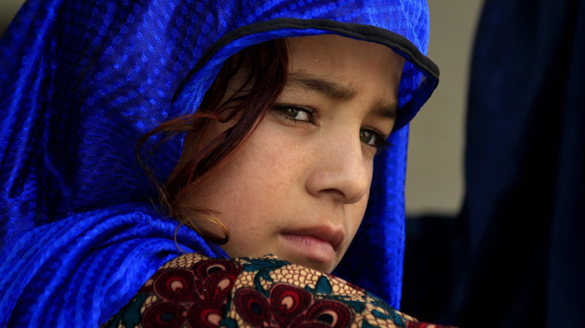 epa07005516 Afghan refugee girl waits to get registered at a United Nation High Commissioner for Refugees (UNHCR) registration center in Azakhel area of Nowshera, Khyber Pakhtunkhwa province, Pakistan, 08 September 2018. Pakistan that hosts more than 1.5 million Afghan refugees has repatriated more than one hundred thousands refugees back to their country under an UNHCR voluntarily return program in the last two years. Others are not identified.  EPA/BILAWAL ARBAB