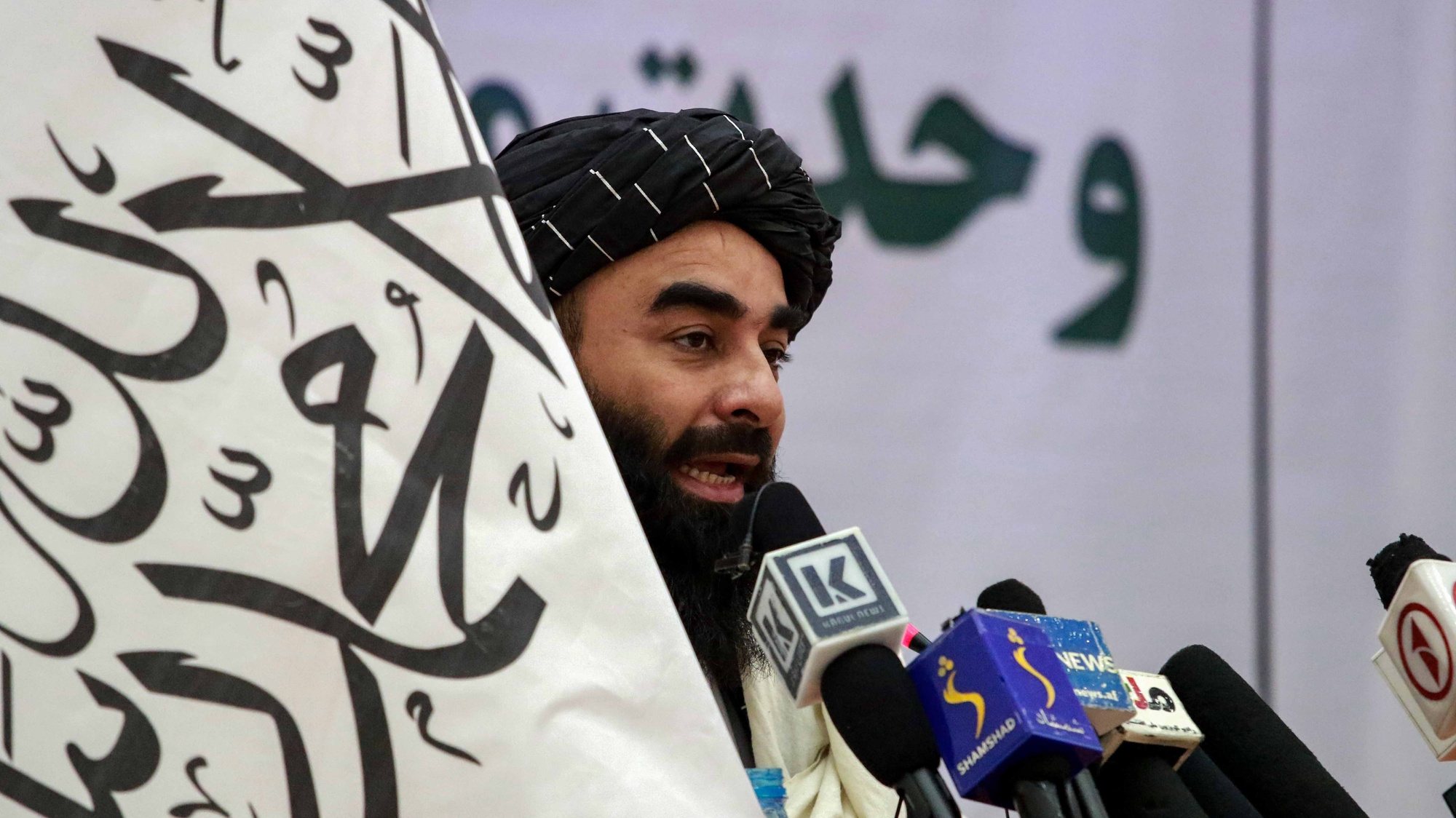 epa09602612 Taliban&#039;s spokesman Zabiullah Mujahid talks with audience during a ceremony in which Shi&#039;ite Muslims and their elders gathered to promote inter-faith harmony, in Kabul, Afghanistan, 25 November 2021. According to a press release issued by the Taliban, the participants of the meeting expressed their support for the Taliban government, and stressed on the unity among the nations and religions in the country. Despite facing strong opposition, the IS militants who have been actively targeting the Shi&#039;ite Muslims and Taliban, has a strong presence in the capital and remote areas of Nangarhar and has now emerged as a major threat to the Taliban, being able to carry out attacks such as the one at Kabul airport on August 26 leaving at least 170 dead.  EPA/STRINGER