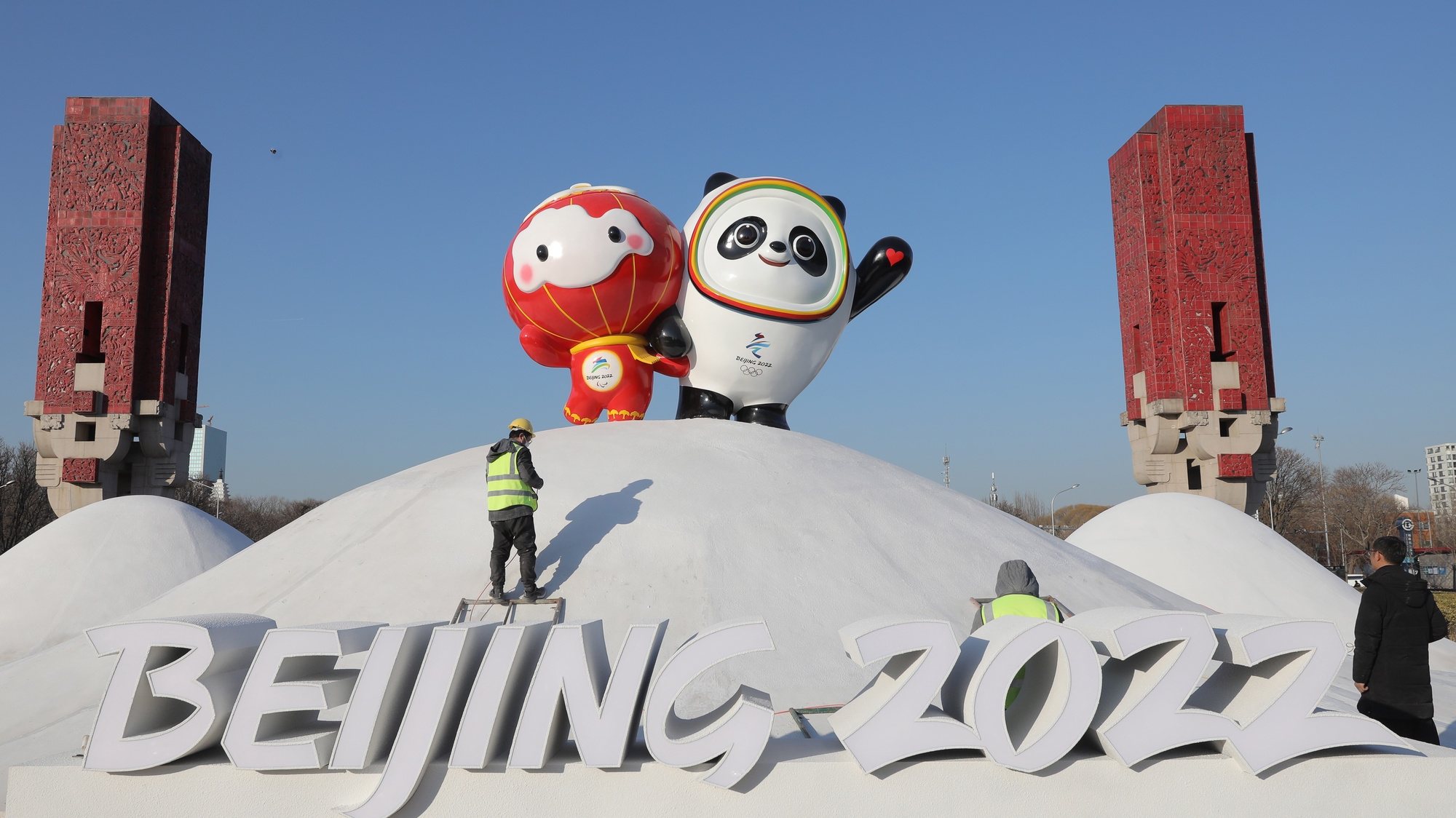 epaselect epa09678214 Chinese workers spray paint near the Bing Dwen Dwen, the Beijing 2022 Winter Olympic Mascot and Shuey Rhon Rhon, the 2022 Beijing Winter Paralympic Games Mascot, in Beijing, China, 11 January 2022. China is scheduled to host the Beijing 2022 Olympic and Paralympic Winter Games in February, making its capital the first city in the world to host both Summer (2008) and Winter Olympics (2022).  EPA/WU HONG