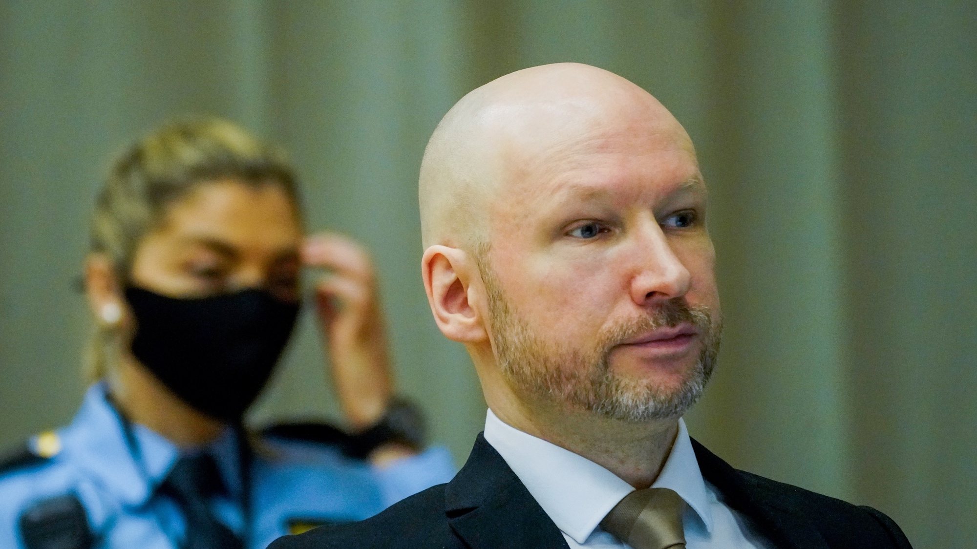 epa09692606 Anders Behring Breivik, convicted of terrorism, attends the first day of his parole hearing, in Skien, Norway, 18 January 2022. Breivik, who changed his name to Fjotolf Hansen in 2017, is to appear before court for his three-days parole hearing in Oslo on 18 January 2022. Mass murderer Anders Behring Breivik was sentenced to a maximum term of 21 years for killing 77 people in bomb and shooting attacks on 22 July 2011, and is entitled under Norwegian law to have his sentenced reviewed after ten years served. The case is being processed by Telemark District Court, but is physically taking place in a makeshift courtroom in Skien prison.  EPA/Ole Berg-Rusten / POOL NORWAY OUT