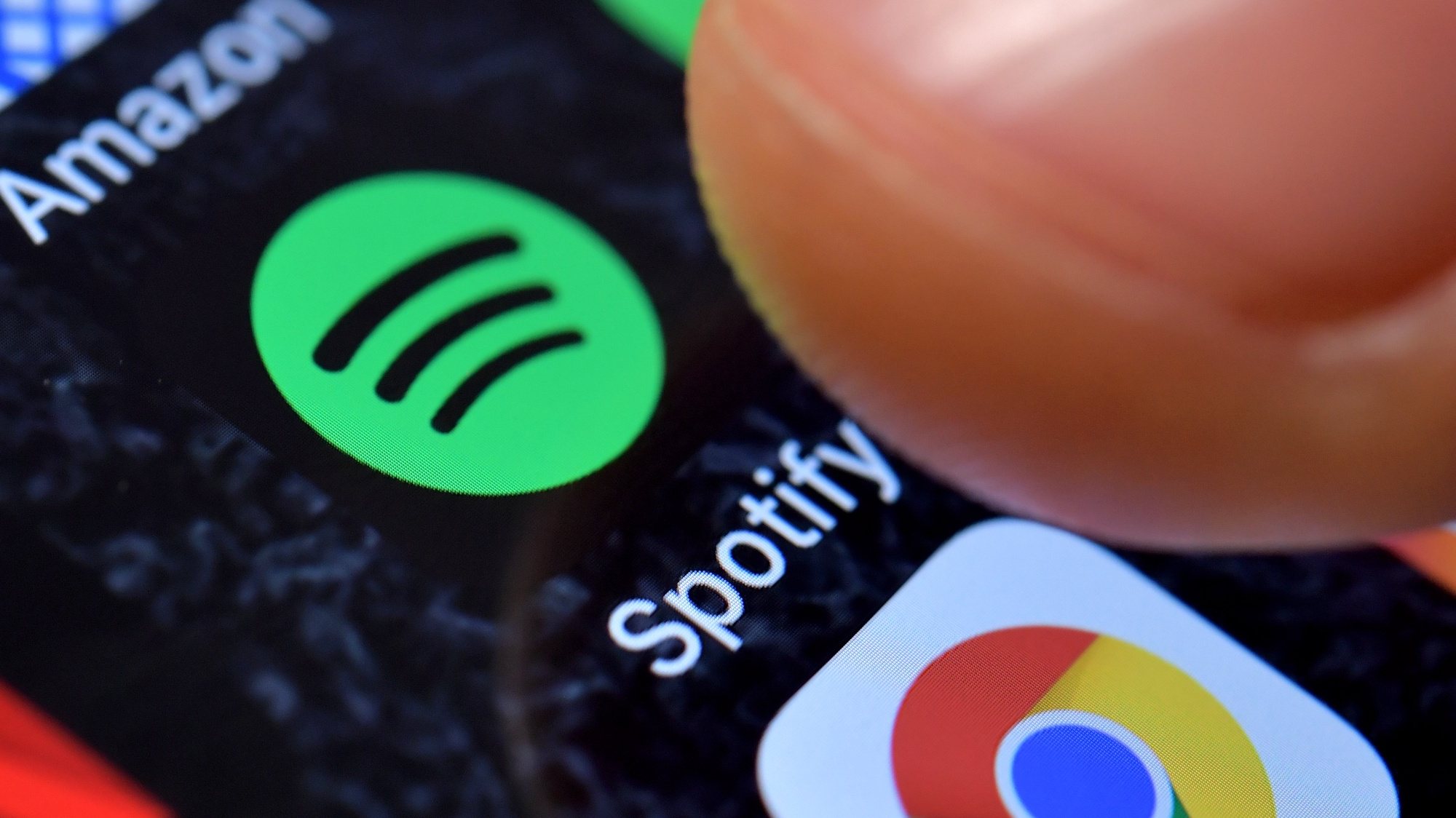 epa09044615 (FILE) - A close-up image showing the Spotify Music app on an iPhone in Kaarst, Germany, 08 November 2017 (reissued 01 March 2021). Spotify confirmed on 01 March 2021 it had removed hundreds of K-Pop releases from its worldwide streaming services over licensing disputes with South Korean distributor Kakao M.  EPA/SASCHA STEINBACH *** Local Caption *** 56665503