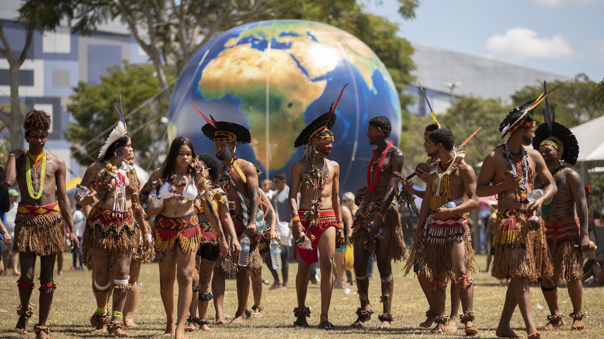epa09872176 Indigenous people of various ethnic groups gather in the Esplanade of the Ministries where the camp for free land will be held for the next ten days, in Brasilia, Brazil, 05 April 2022. Nearly 8,000 people from 100 traditional towns begin this 05 April the 18th edition of the so-called Terra Livre Camp (ATL), which under the theme &#039;Retake Brazil: Demarcating Territories and People&#039;s Policies&#039;, resumes this 2022 its great mobilization in the capital Brazilian after two years of on-line activities due to the covid-19 pandemic.  EPA/Joedson Alves