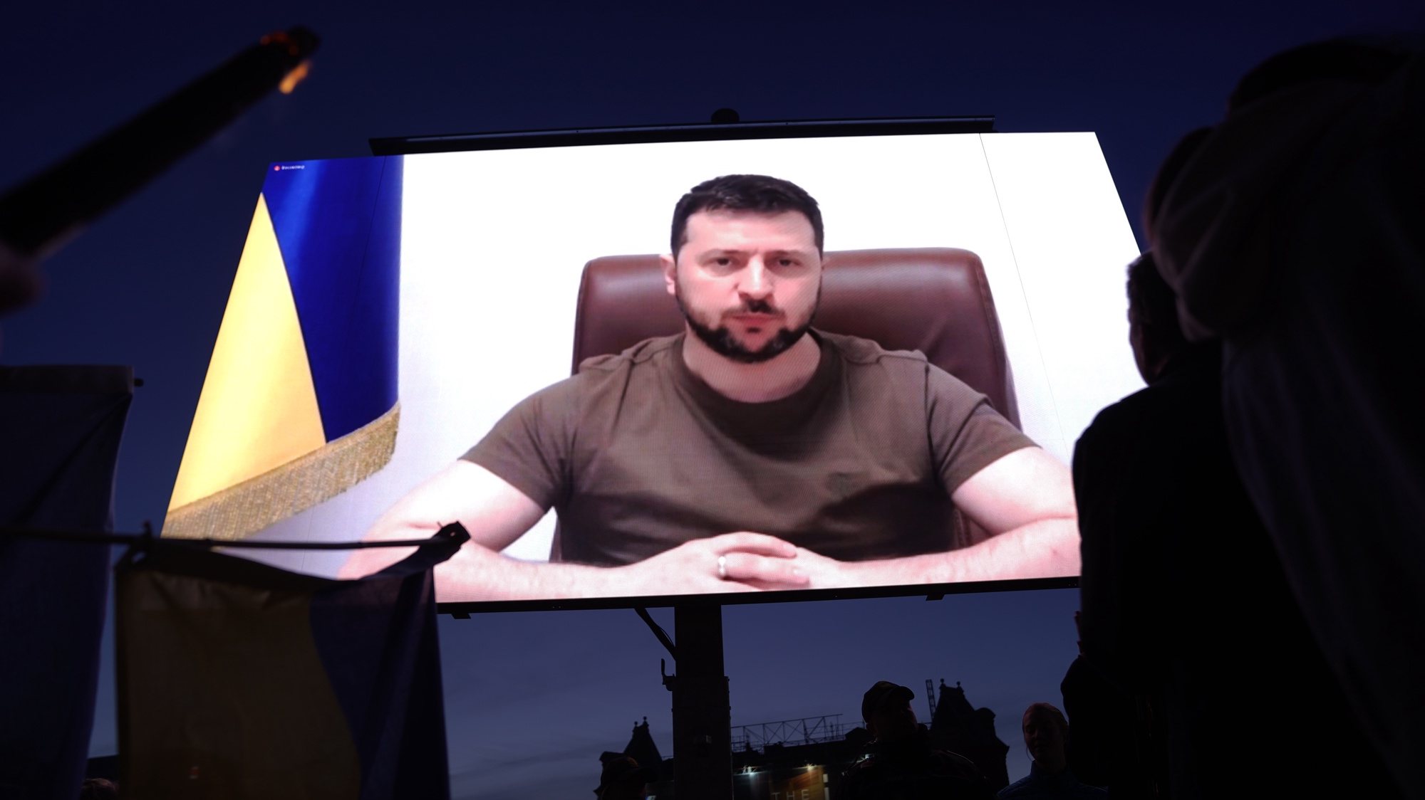 epa09927002 Ukranian President Volodymyr Zelensky appears on screen to address people at the City Hall Square in Copenhagen, Denmark, 04 May 2022. The event marking the 04 May anniversary of the Nordic country&#039;s liberation at the end of the Second World War, was organized by JP/Politiken Media Group.  EPA/LISELOTTE SABROE  DENMARK OUT