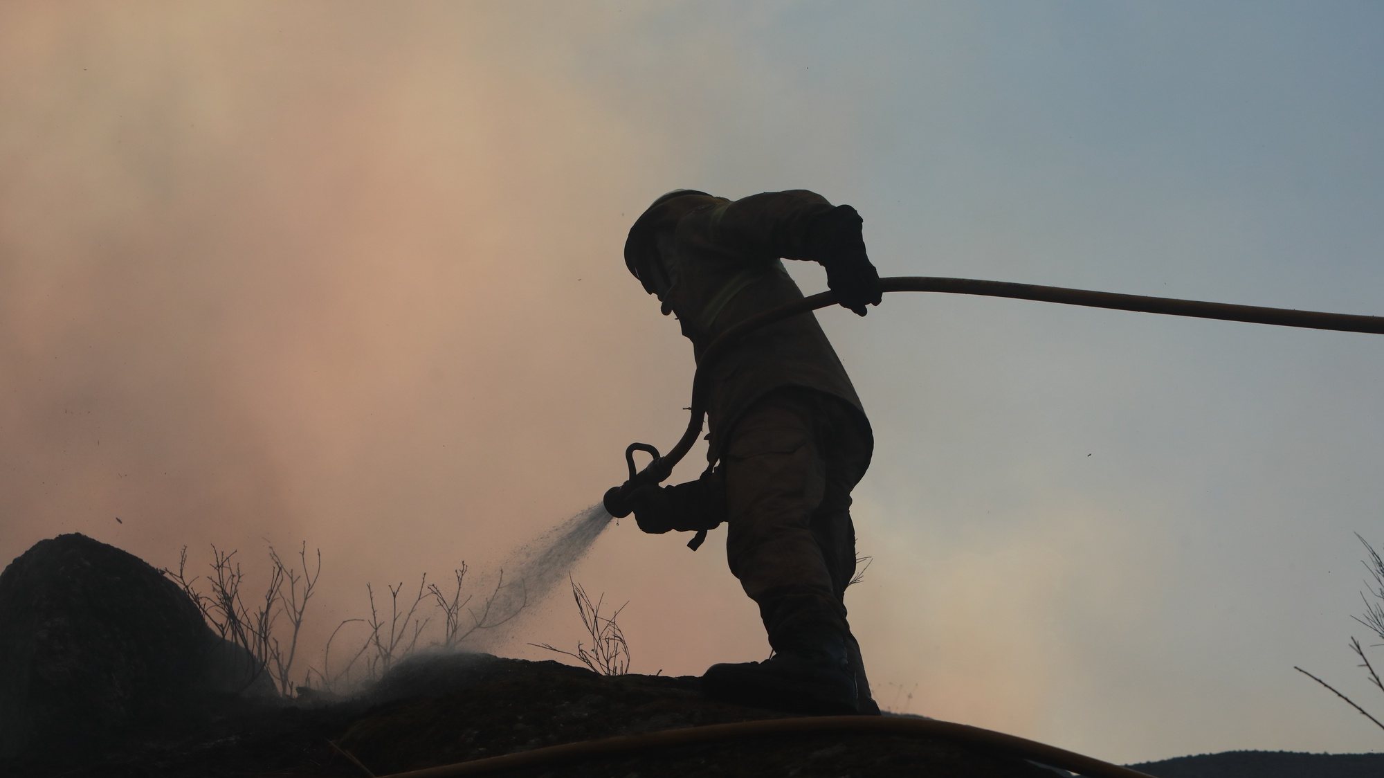 A fireman fights a forest fire in Alvendre, near Guarda, Portugal, 18 July 2022. 276 operational and 81 vehicles are fighting the forest fire. MIGUEL PEREIRA DA SILVA/LUSA