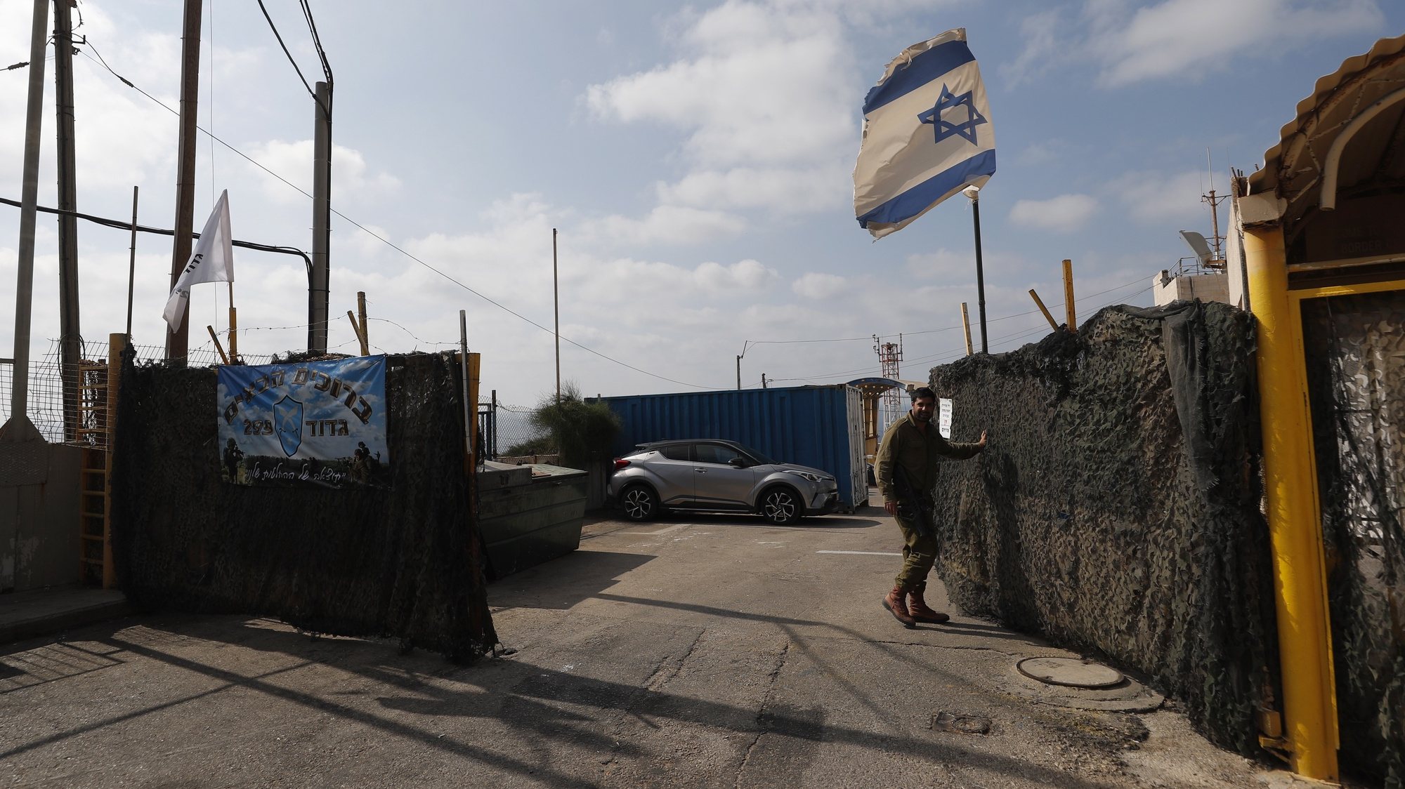 epa09999190 An Israeli soldier opens a gate of an Israeli army base next to Rosh Hanikra, near Haifa at the Israel-Lebanon border, 06 June 2022. Lebanese President Michel Aoun stressed that &#039;any Israeli exploration, excavation or extraction activities carried out in the disputed areas constitute an act of aggression&#039; after natural gas storage and production ship Energean entered into the disputed area in the southern maritime borders. Aoun also asked the Lebanese army leadership to provide him with accurate and official data in this regard.  EPA/ATEF SAFADI