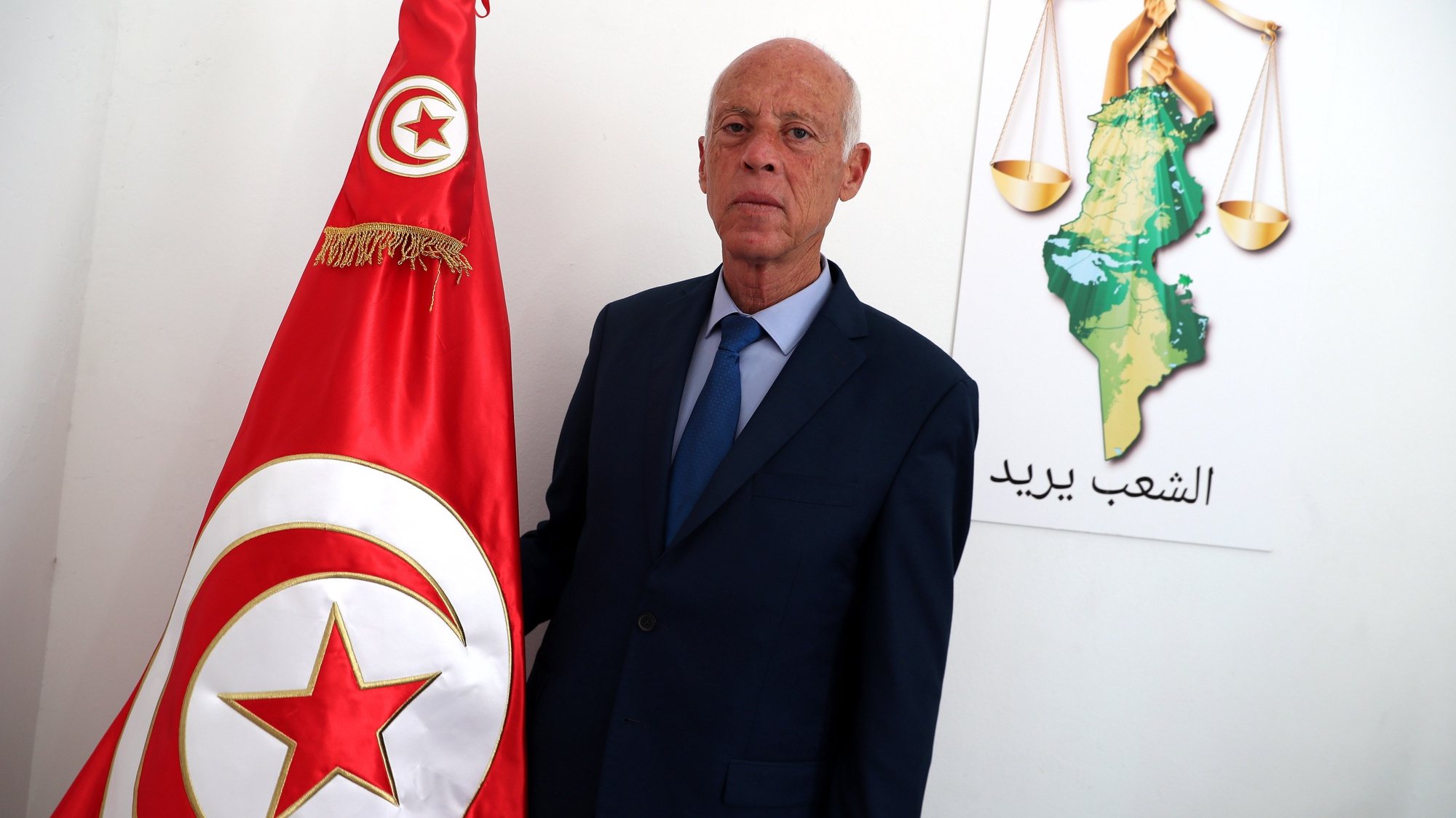 epa07846948 Tunisian presidential candidate Kais Saied poses for a photo at his campaign headquarters in Tunis, Tunisia, 16 September 2019. According to reports, preliminary results showed presidential candidates Kais Said, a 61-year-old law professor, and imprisoned businessman Nabil Karoui are leading the first round of voting and expected to face off in the second round in October.  EPA/MOHAMED MESSARA