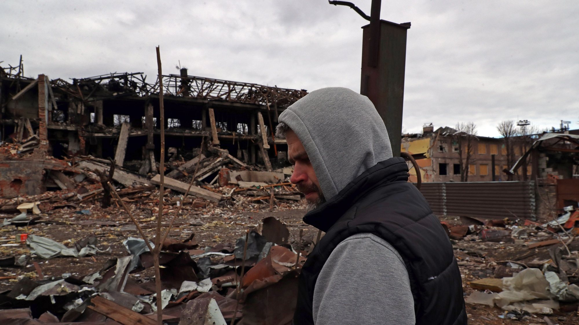 epa09852783 Ukranian Artem visits the damaged shoes factory shelled by a missile on 11 March causing the death of the facility security, in Dnipro, Ukraine, 27 March 2022. On 24 February Russian troops had entered Ukrainian territory in what the Russian president declared a &#039;special military operation&#039;, resulting in fighting and destruction in the country, a huge flow of refugees, and multiple sanctions against Russia.  EPA/NUNO VEIGA