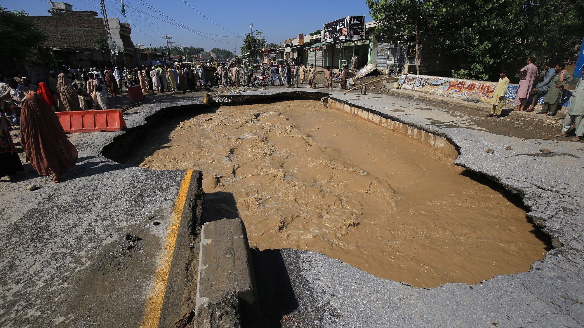 epa10143334 A damaged road in the aftermath of floods in Charsadda District, Khyber Pakhtunkhwa province, Pakistan, 28 August 2022. According to the National Disaster Management Authority (NDMA) on 27 August, flash floods triggered by heavy monsoon rains have killed over 1,000 people across Pakistan since mid-June 2022. More than 33 million people have been affected by floods, the country&#039;s climate change minister said.  EPA/ARSHAD ARBAB