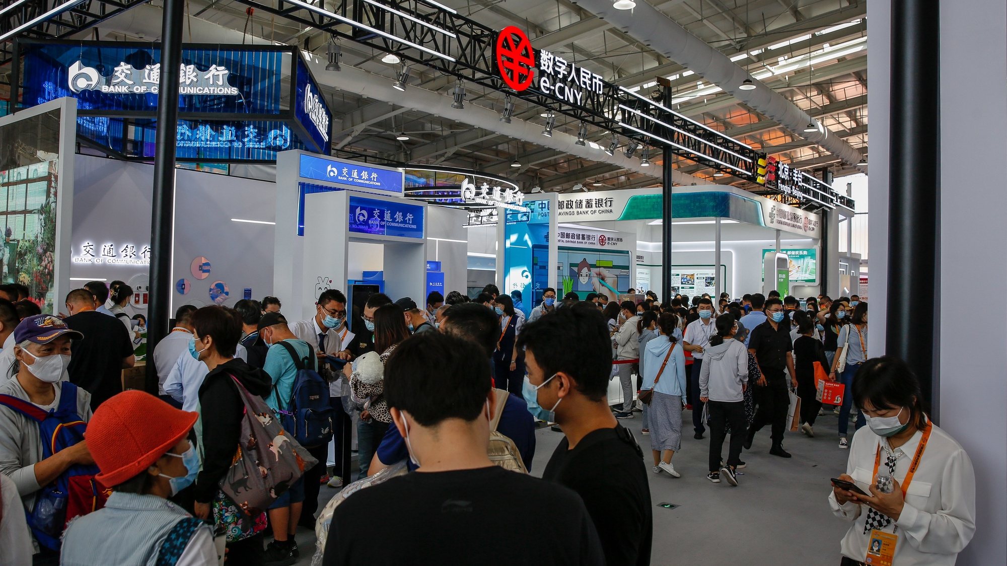 epa10160779 Visitors at the financial services area using e-CNY or digital yuan during the China International Fair for Trade in Services (CIFTIS) at the Shougang Park in Beijing, China, 05 September 2022. The China International Fair for Trade in Services is the largest comprehensive fair for trade in services and the leading fair for trade in services in China.  EPA/MARK R. CRISTINO