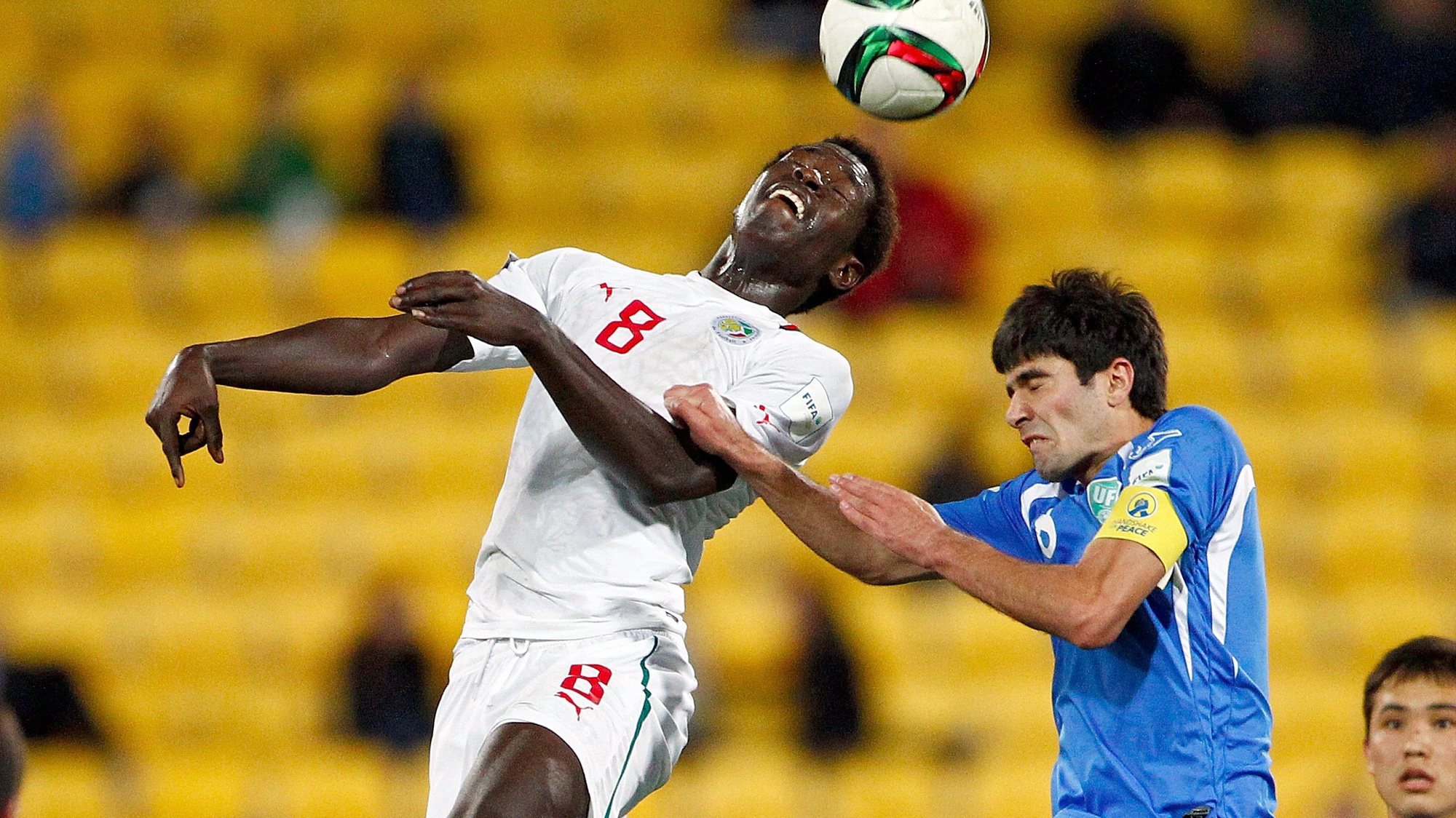 epa04798408 Sidy Sarr of Senegal (L) gets his head to the ball as he jumps in front of Javokhir Sokhibov of Uzbekistan (R) during the FIFA Under-20 World Cup 2015 quarterfinal match between Uzbekistan and Senegal in Wellington, New Zealand, 14 June 2015.  EPA/DEAN PEMBERTON EDITORIAL USE ONLY NOT TO BE USED IN ASSOCATION WITH ANY COMMERCIAL ENTITY - IMAGES MUST NOT BE USED IN ANY FORM OF ALERT OR PUSH SERVICE OF ANY KIND INCLUDING VIA MOBILE ALERT SERVICES, DOWNLOADS TO MOBILE DEVICES OR MMS MESSAGING