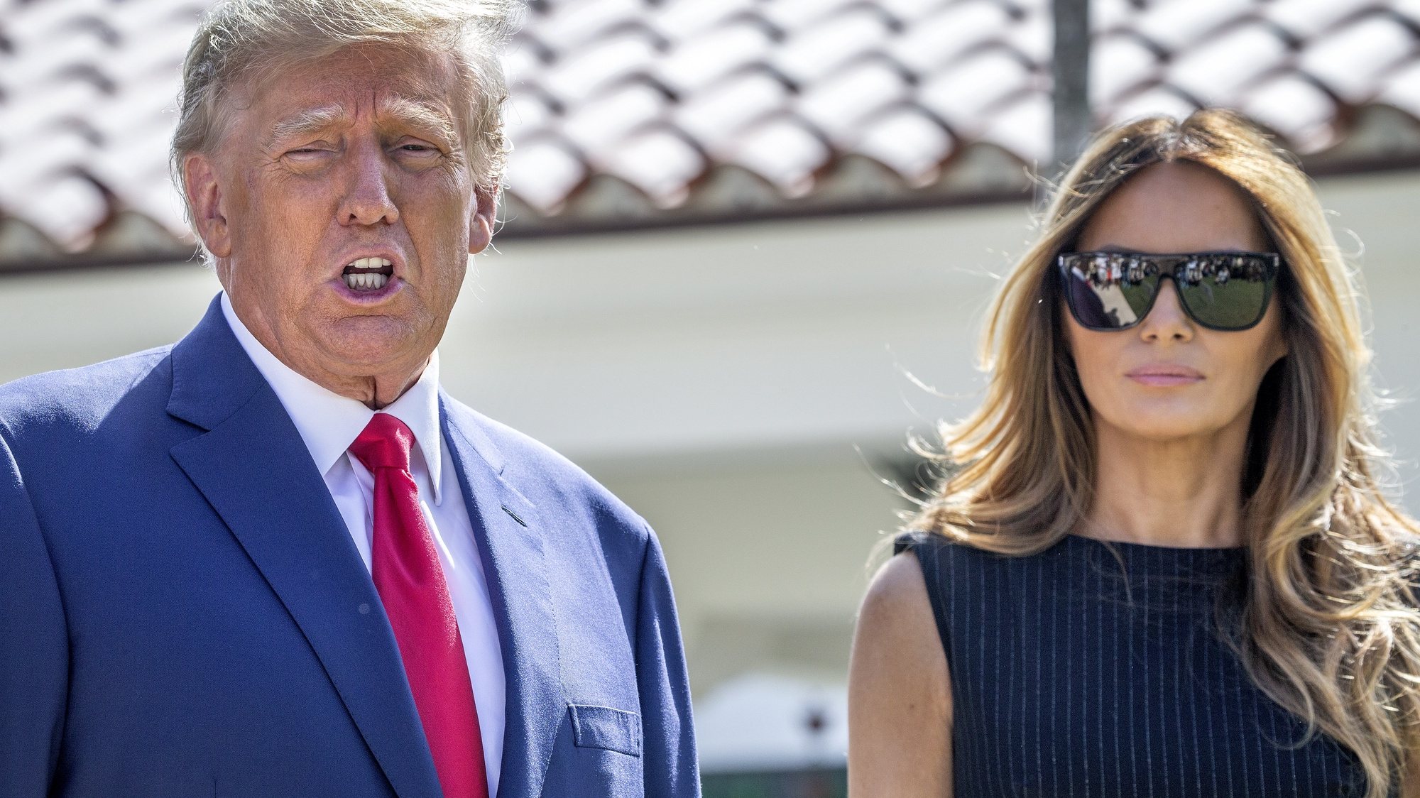 epa10294160 Former US President Donald J. Trump (L) and former First Lady Melania Trump (R), walk out of the electoral precinct after voting in-person at the Morton and Barbara Mandel Recreation Center in Palm Beach, Florida, USA, 08 October 2022. The US midterm elections are held every four years at the midpoint of each presidential term and this year include elections for all 435 seats in the House of Representatives, 35 of the 100 seats in the Senate and 36 of the 50 state governors as well as numerous other local seats and ballot issues.  EPA/CRISTOBAL HERRERA-ULASHKEVICH