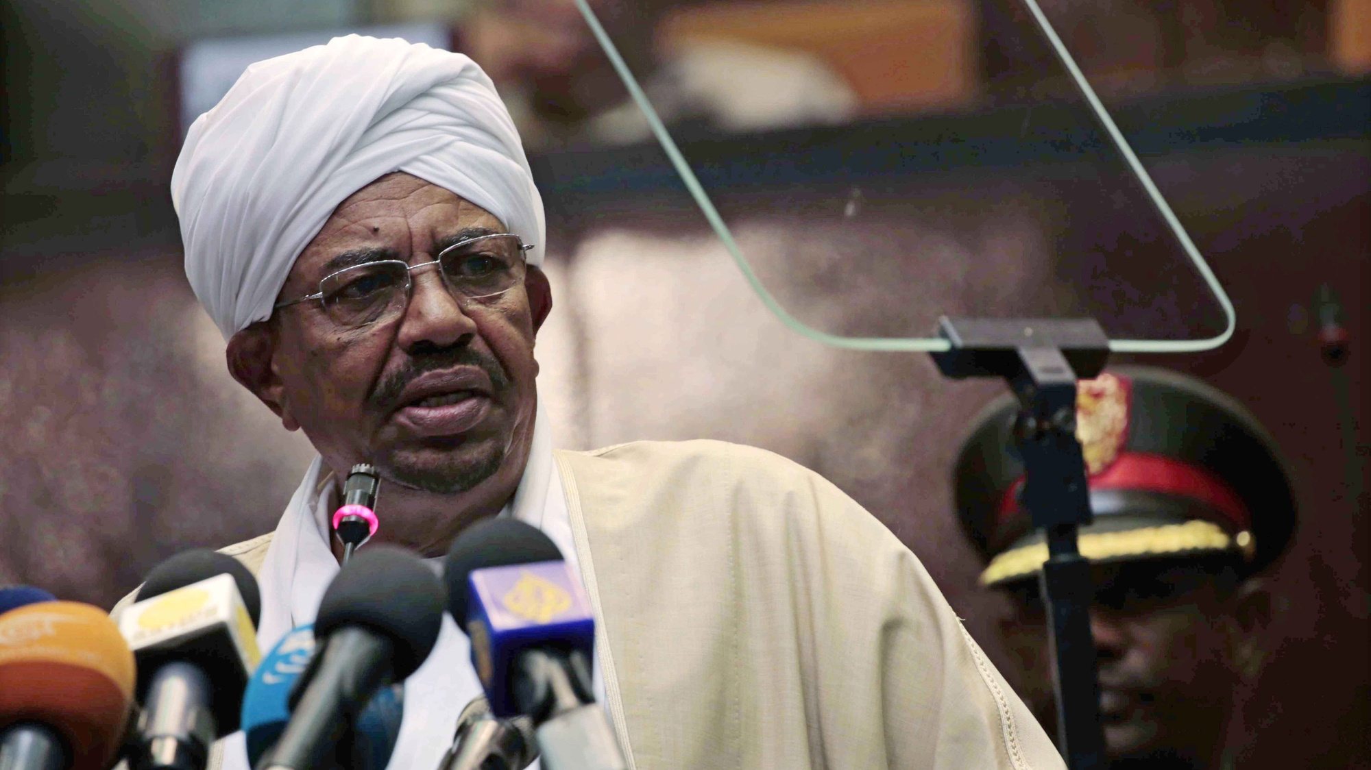epa08211254 (FILE) - President of Sudan, Omar al-Bashir, addresses Parliament in Khartoum, Sudan, 19 October 2015 (reissued 11 February 2020). According to reports on 11 February 2020, Sudanese authorities will hand ousted president Omar al-Bashir to the International Criminal Court (ICC), where he will be facing charges of war crimes and crimes against humanity related to the war in the Darfur region.  EPA/MORWAN ALI *** Local Caption *** 55400122