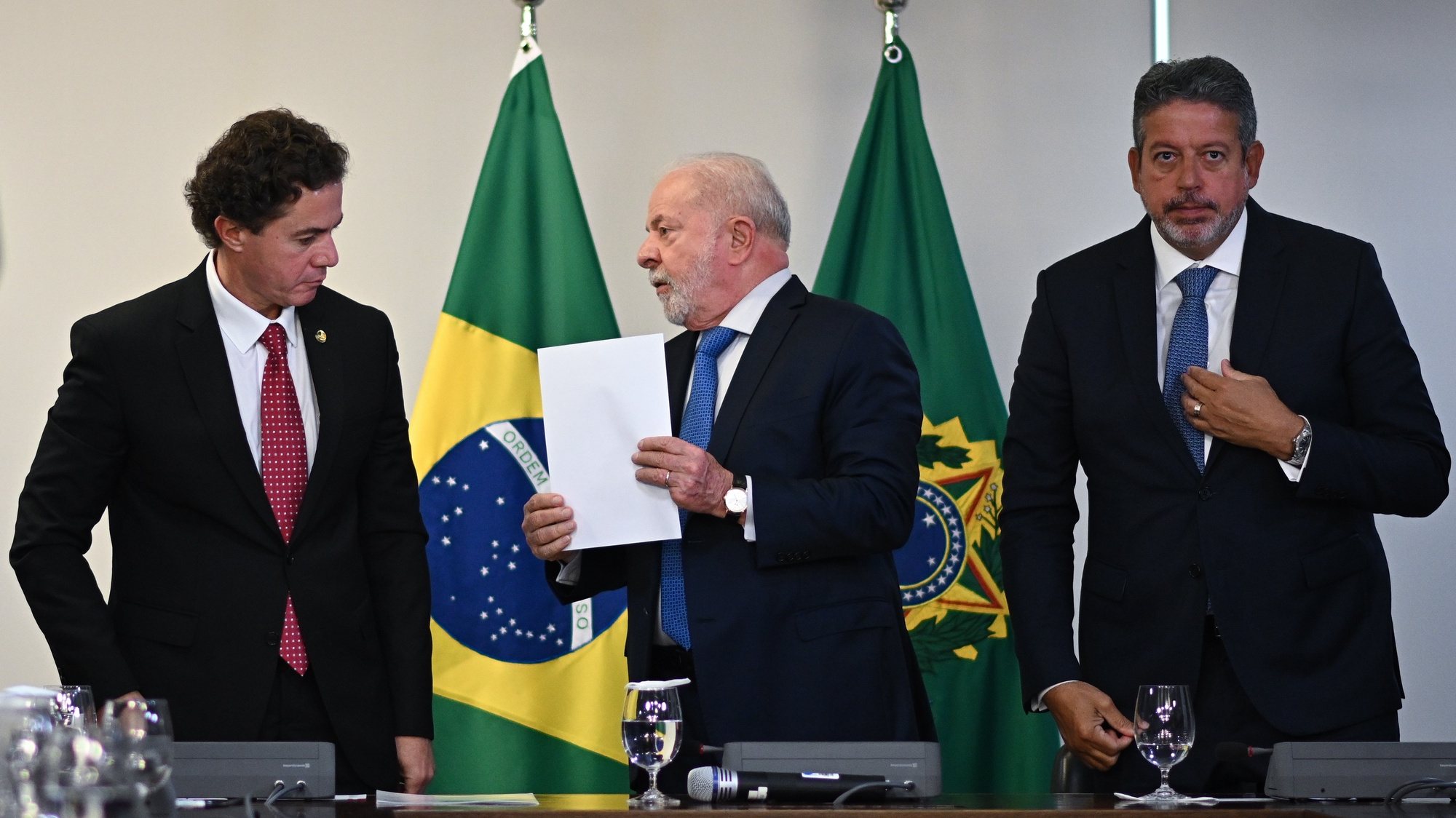 epa10400377 Brazilian President Luiz Inacio Lula da Silva (C), Vice President of the Senate,Veneziano Vital do Rego (L) and President of the Chamber of Deputies Arthur Lira (R) attend a meeting to hand over the approval of the legislative decree of federal intervention to guarantee the security of the Federal District, at the Planalto Palace, in Brasilia, Brazil, 11 January 2023. Lula regretted that his predecessor, Jair Bolsonaro, had not yet publicly acknowledged his defeat following the October 2022 elections. Thousands of Bolsonaro supporters stormed government offices on 08 January, leading authorities to bolster security nationwide.  EPA/ANDRE BORGES