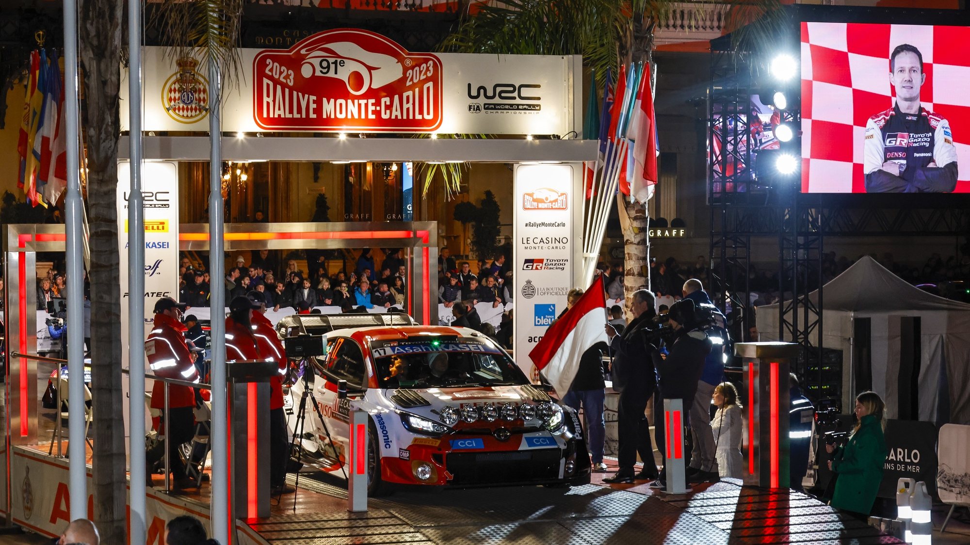 epa10416515 The Toyota GR Yaris Rally1 Hybird driven by French driver Sebastien Ogier and his co-driver Vincent Landais of Toyota Gazoo Racing WRT at the start of the Rallye Monte Carlo 2023, in Monte Carlo, Monaco, 19 January 2023.  EPA/Nikos Mitsouras