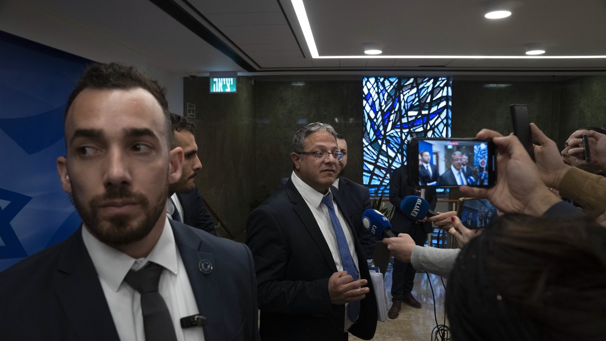 epa10422251 Israel’s Minister of National Security Itamar Ben-Gvir (C) speaks to journalists on arrival to the weekly cabinet meeting in Jerusalem, 22 January 2023. The Israeli Supreme Court ruled on 18 January 2023 that the appointment of Knesset member Rabbi Aryeh Makhlouf Deri to the position of Minister of the Interior and Health cannot stand. According to reports, the court ordered Prime Minister Benjamin Netanyahu to fire Deri from his post today.  EPA/Maya Alleruzzo / POOL