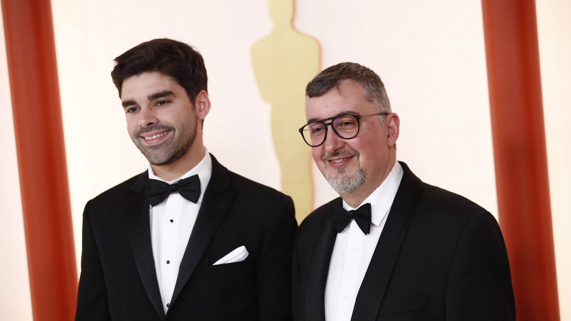 epa10517751 (L-R) Joao Gonzalez and Bruno Caetano arrive for the 95th annual Academy Awards ceremony at the Dolby Theatre in Hollywood, Los Angeles, California, USA, 12 March 2023. The Oscars are presented for outstanding individual or collective efforts in filmmaking in 24 categories.  EPA/CAROLINE BREHMAN