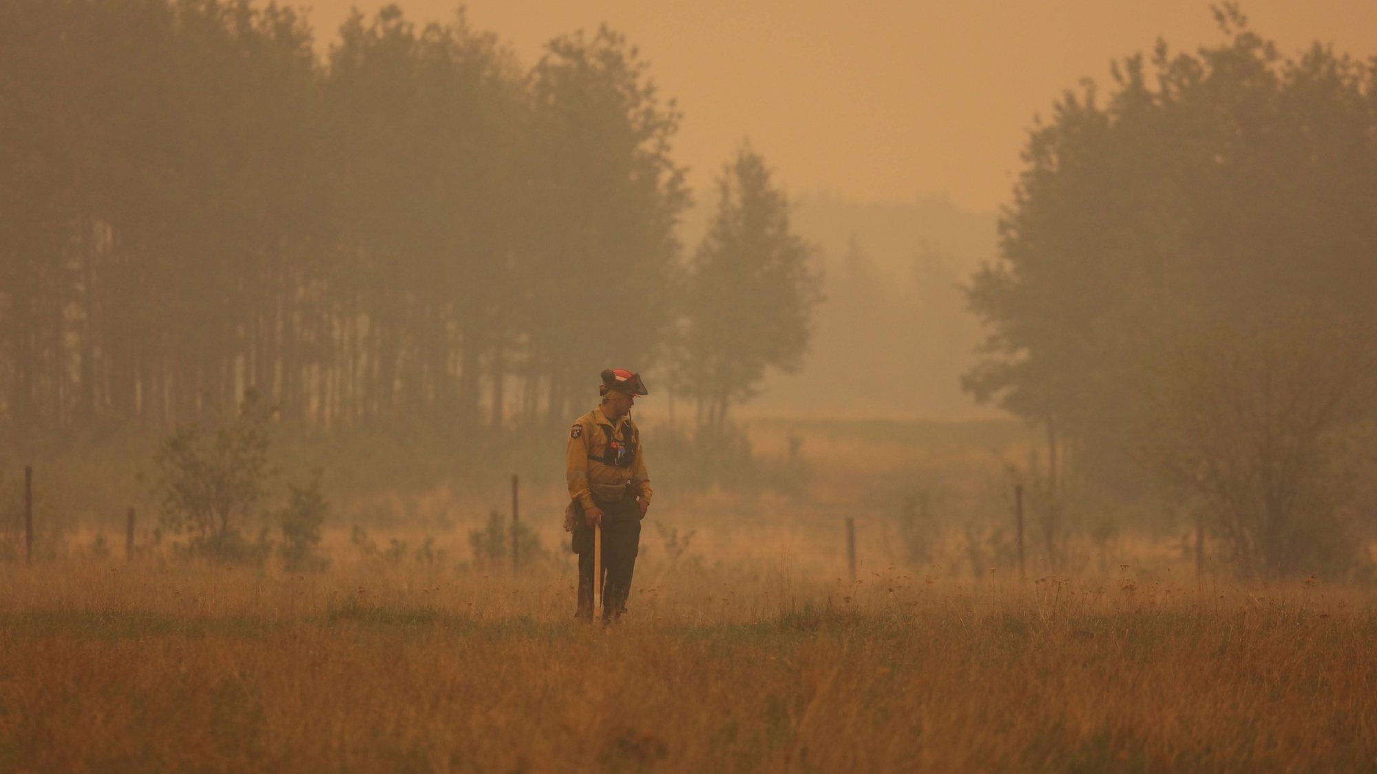 epa10679776 A handout photo made available by Alberta Wildfire showing a firefighter at one of scores of wildfires burning across multiple Canadian Provinces in Sturgeon Lake Cree Nation, Alberta, Canada, 08 June 2023. Smoke from the ongoing Canadian wildfires continues to impact air quality conditions across multiple major US cities.  EPA/ALBERTA WILDFIRE HANDOUT  HANDOUT EDITORIAL USE ONLY/NO SALES