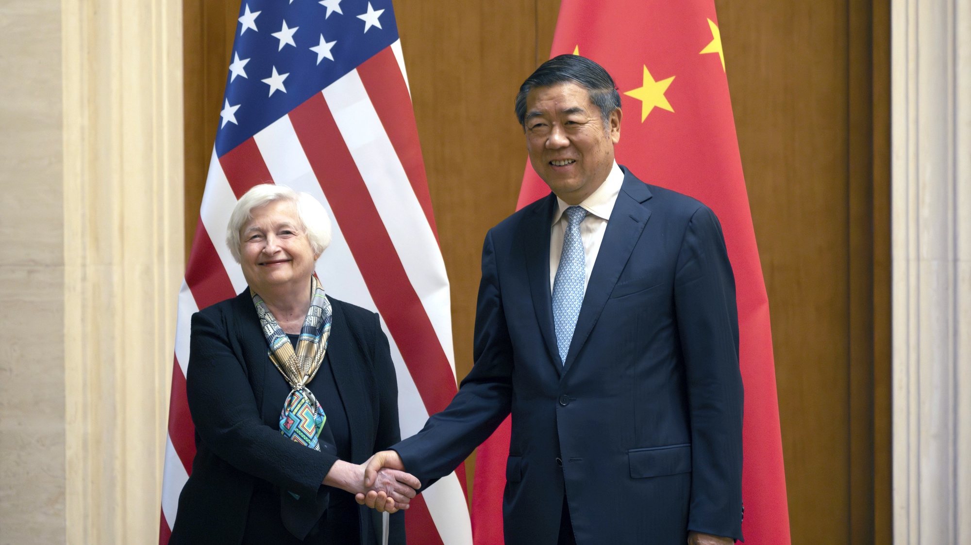 epa10733636 US Treasury Secretary Janet Yellen (L) shakes hands with Chinese Vice Premier He Lifeng during a meeting at the Diaoyutai State Guesthouse in Beijing, China, 08 July 2023.  EPA/MARK SCHIEFELBEIN / POOL
