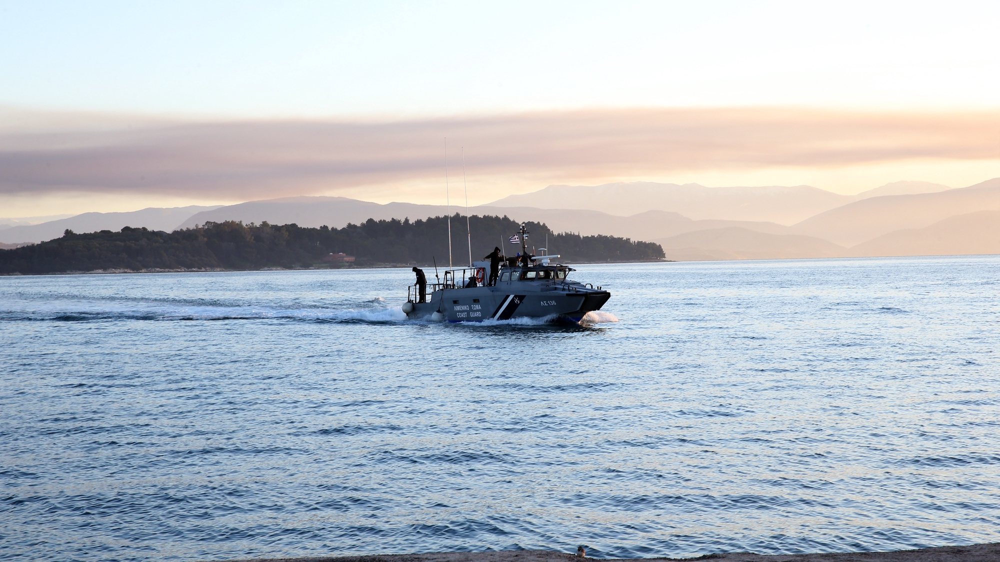 epa09768469 A coast guards boat, carrying a passenger of &#039;Euroferry Olympia&#039; with respiratory problems, arrives at the port of Corfu Island, Greece, 18 February 2022. A fire broke out early on 18 February on Italian-flagged &#039;Euroferry Olympia&#039; while sailing northeast of the island of Ereikousa, near Corfu. The ferry had sailed from Igoumenitsa and was headed to the Italian port of Brindisi. 242 people have been disembarked so far in vessels of the port authorities and the Italian coast guard, which are expected to be transferred to Corfu. The ship Elyros, the frigate Hydra, firefighting boats and other adjacent ships rushed to the sea area where the incident occured.  EPA/STAMATIS KATAPODIS