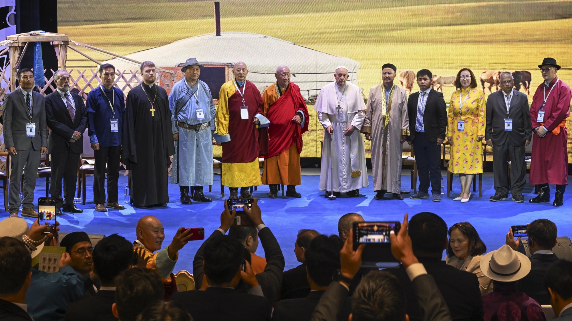 epa10837098 Pope Francis (C-R) attends an ecumenical and interreligious meeting in the Hun Theatre in Ulaanbataar, Mongolia, 03 September 2023.  EPA/CIRO FUSCO