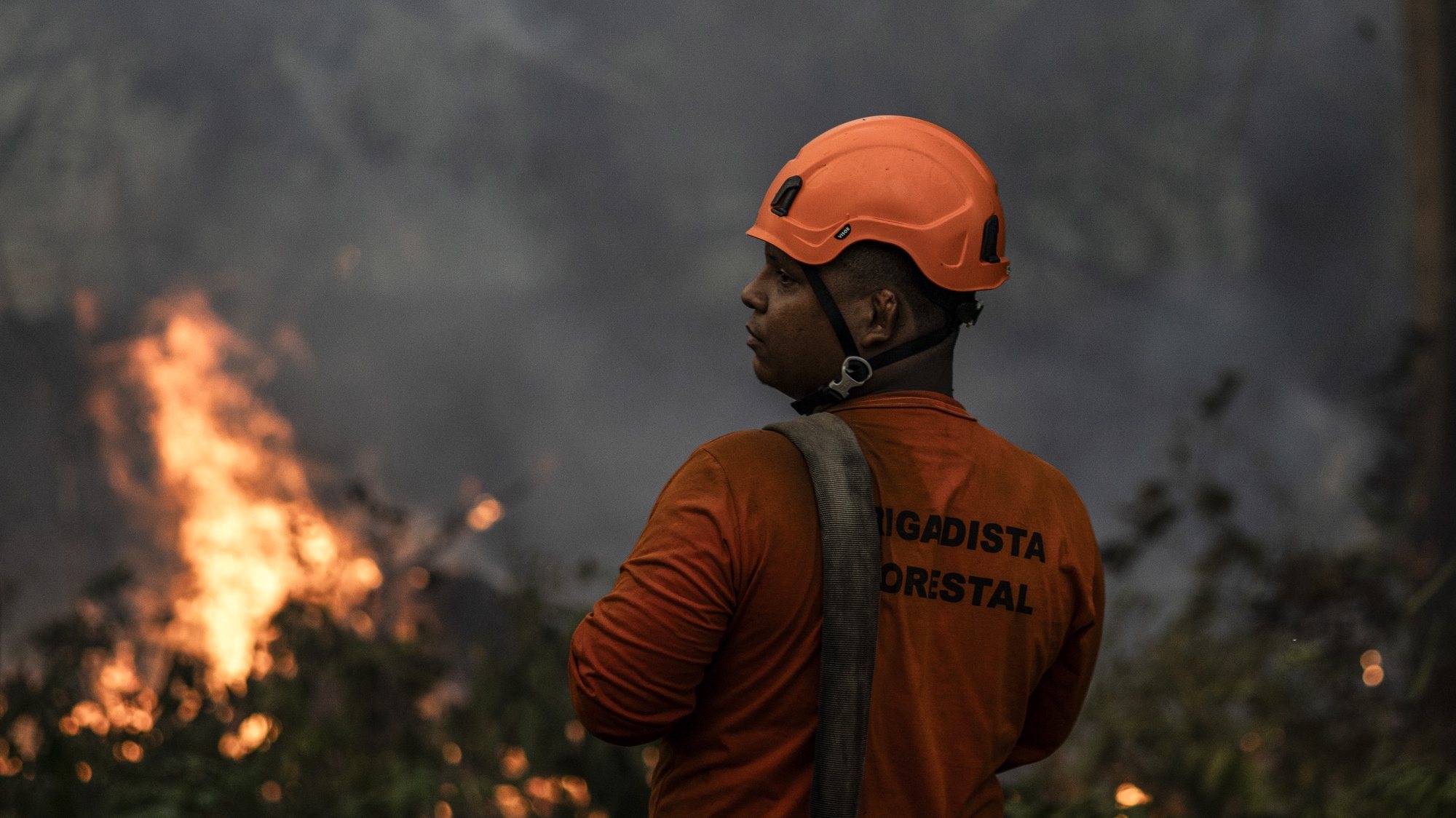 epa10842930 Firefighters working on a fire in a green area between Manaus and Iranduba, in the Amazon, Brazil, on 05 September 2023. The deforested area of the Brazilian Amazon fell 66% in August compared to the same month last year and reached the lowest figure since 2018, according to official data released on 05 September.  EPA/Raphael Alves