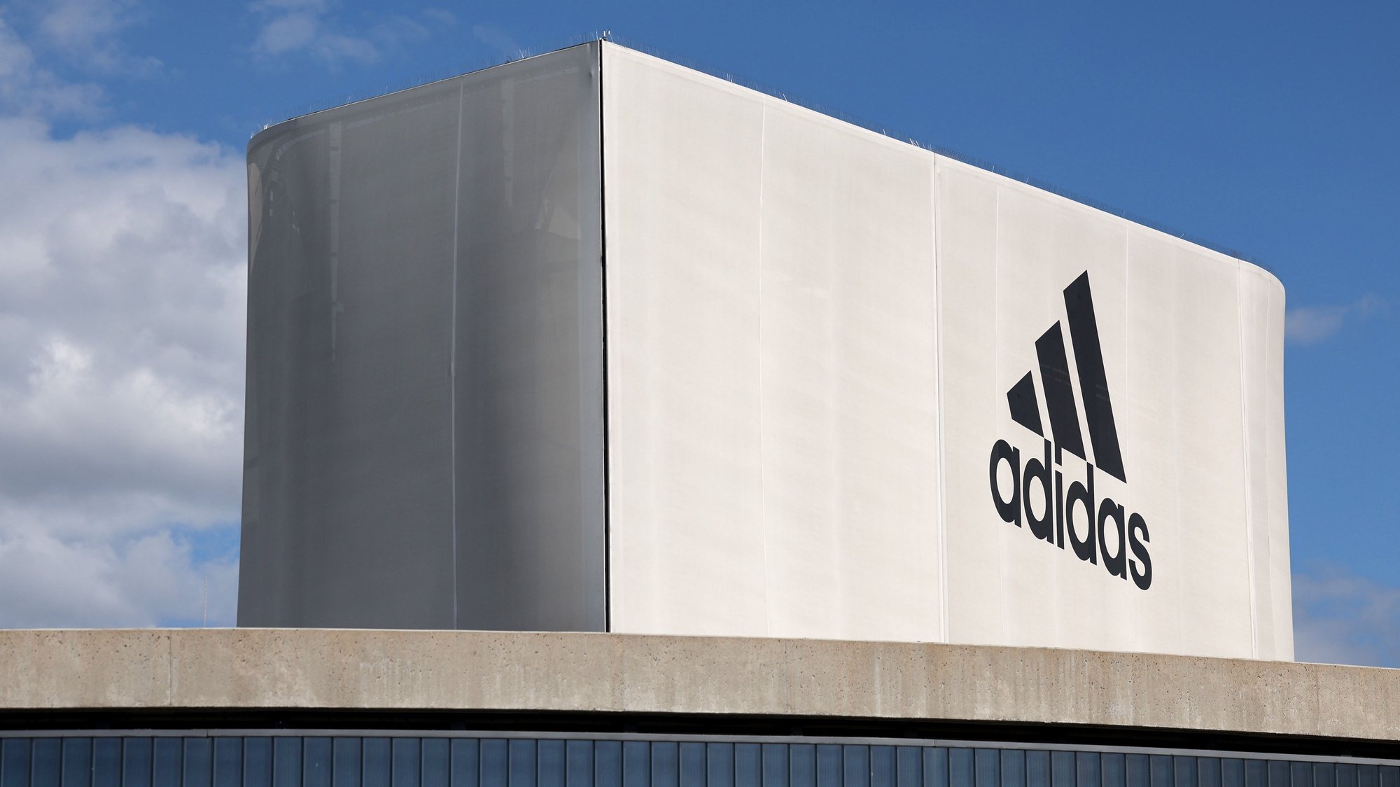 epa10724809 The Adidas logo is seen at an official store at the Adidas World of Sports campus in Herzogenaurach, Germany, 03 July 2023.  EPA/ANNA SZILAGYI