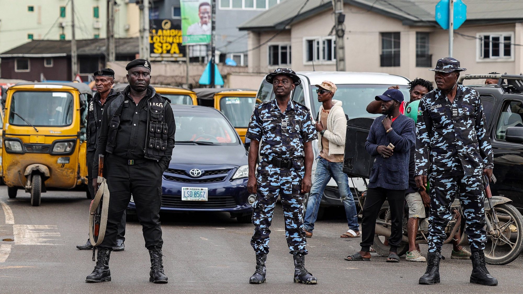 epa10780985 Security forces members stand guard during nationwide protests over the removal of fuel subsidies in Lagos, Nigeria, 02 August 2023. The popular fuel subsidies were removed last May by President Bola Tinubu citing budgetary concerns and reversely affected many low income people, leaving many unable to meet the costs of education, food and healthcare.  EPA/SAMUEL ALABI