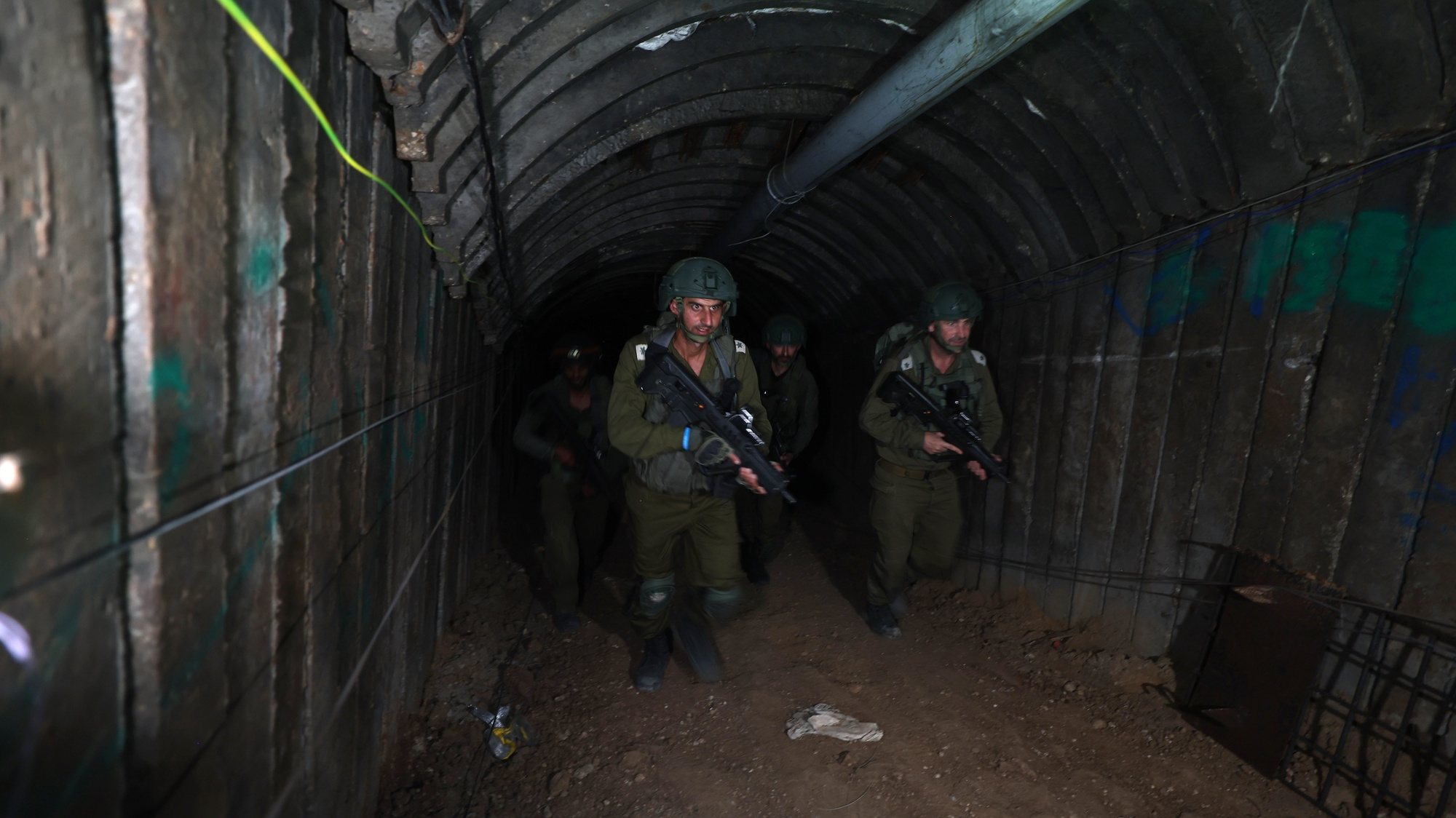 epa11034258 A photo taken while embedded with the Israeli Army shows soldiers inside a tunnel 400 meters away from the Erez crossing between Gaza and Israel, in the Palestinian town of Beit Hanun, northern Gaza Strip, 15 December 2023 (issued 17 December 2023). At least 18,000 Palestinians and at least 1,200 Israelis have been killed, according to the Palestinian Health Ministry and the Israel Defense Forces (IDF), since Hamas militants launched an attack against Israel from the Gaza Strip on 07 October, and the Israeli operations in Gaza and the West Bank which followed it.  EPA/ATEF SAFADI
