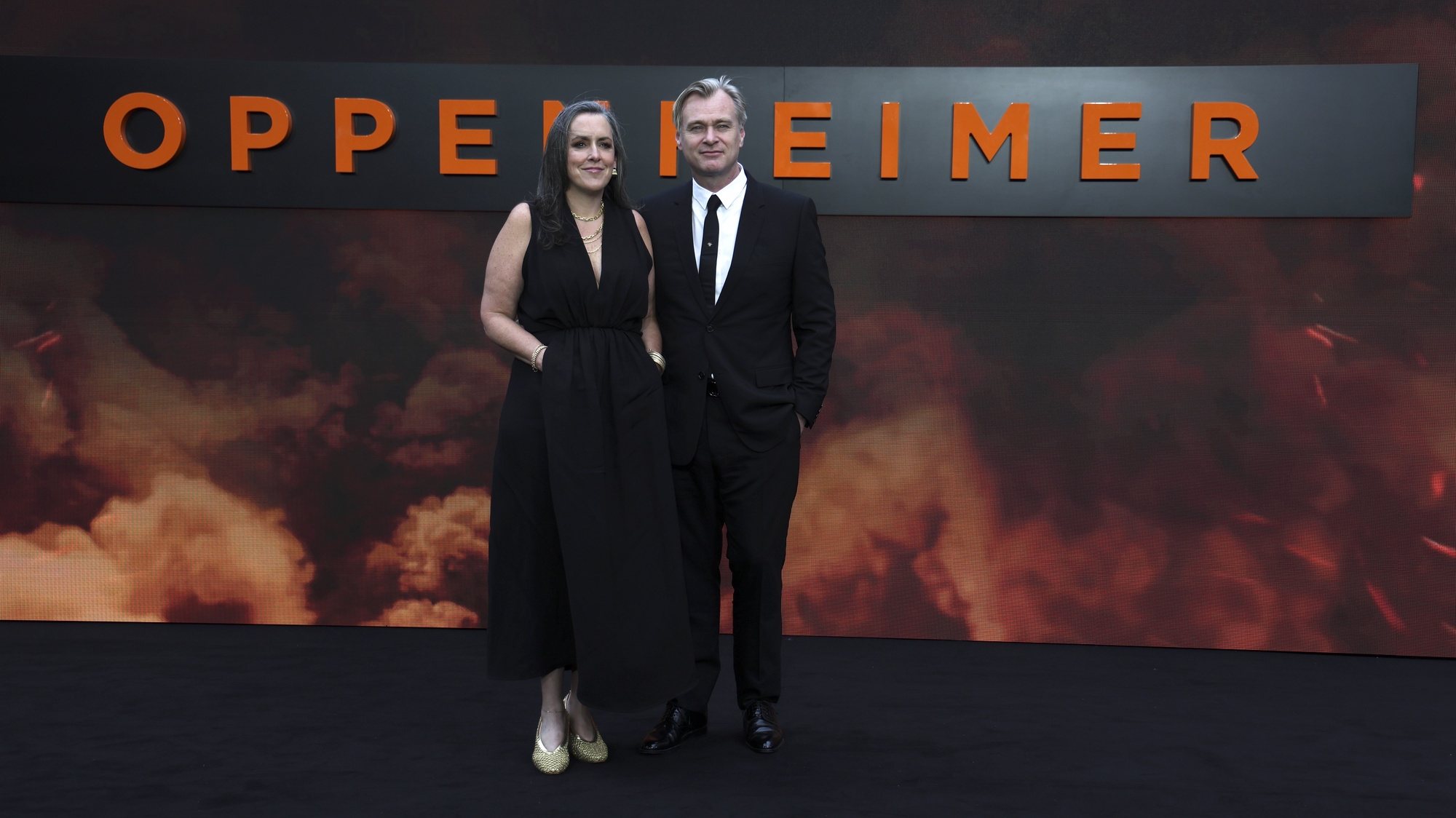 epa10744320 British producer Emma Thomas (L) and British director Christopher Nolan (R) attend the UK premiere of Oppenheimer in central London, Britain, 13 May 2023. The film will be released in British cinemas on the 21 July 2023.  EPA/ANDY RAIN