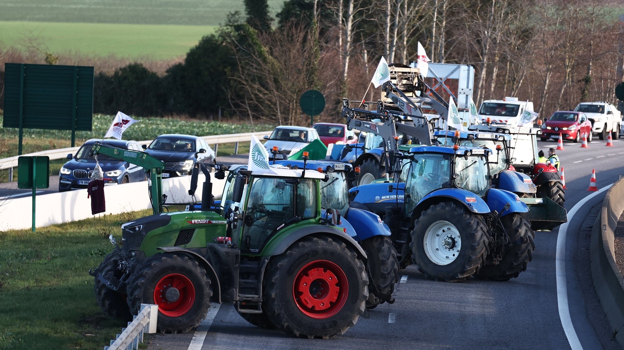 epa11106539 Dozens of tractors block a highway near Ableiges, north of Paris, France, 26 January 2024. French farmers continue their protests with road blockades and demonstrations in front of state buildings awaiting a response from the government to their request for &#039;immediate&#039; aid of several hundred million euros. On 23 January, the EU Agriculture and Fisheries Council highlighted the importance of providing the conditions necessary to enable EU farmers to ensure food security sustainably and profitably, as well as ensuring a fair income for farmers.  EPA/Mohammed Badra