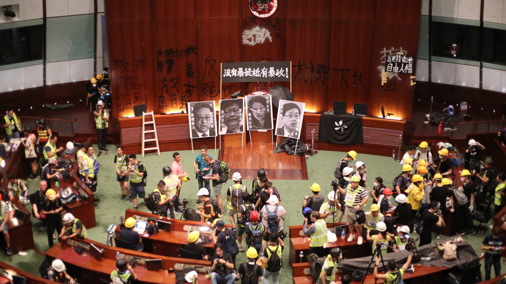 epa07687502 A general view of the main chamber after protesters break into the Legislative Council building during the annual 01 July pro-democracy march in Hong Kong, China, 01 July 2019. Protesters are demanding the resignation of Hong Kong Chief Executive Carrie Lam and the full withdrawal of a suspended extradition bill. On 01 July, Hong Kong marks the 1997 transfer of sovereignty of Hong Kong from Britain to China.  EPA/RITCHIE B. TONGO