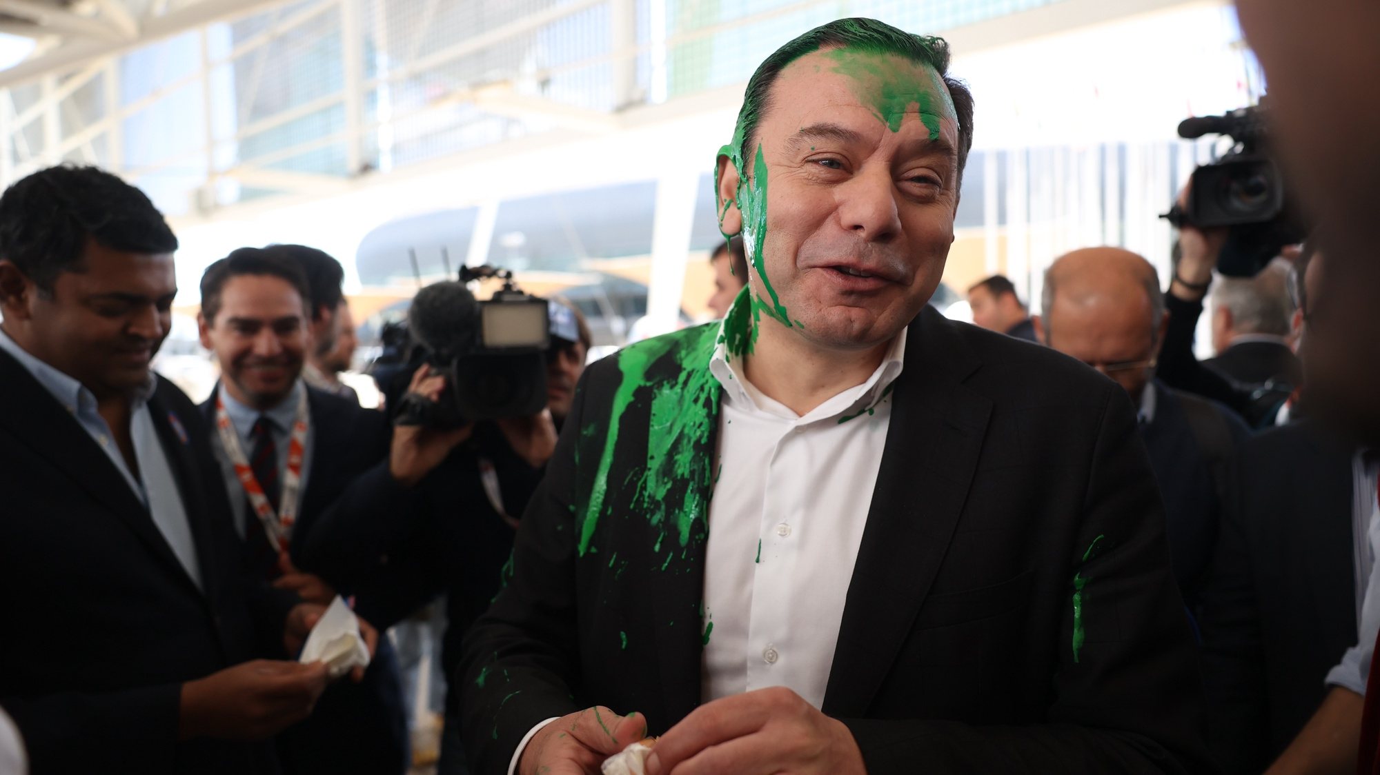 The president of the Democratic Social Party (PSD) Luis Montenegro (C) reacts after being hit with paint at his arrival at the Lisbon Tourism Fair (BTL) during a Democratic Alliance (AD) campaign, as part of the campaign for upcoming legislative elections, in Lisbon, Portugal, 28 February 2024. On January 15, the President of the Republic decreed the dissolution of parliament and the calling of early legislative elections on 10 March, following the resignation of Prime Minister Antonio Costa presented on 07 November 2023. ANDRE KOSTERS/LUSA