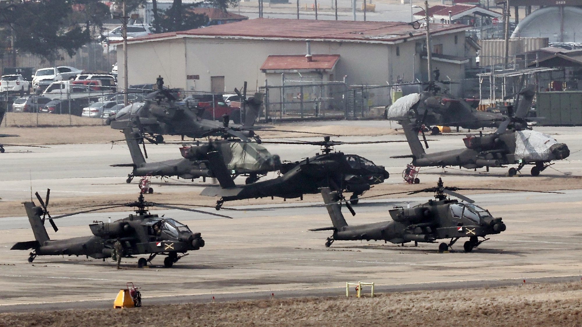 epa11197939 Apache choppers take off at Camp Humphreys in Pyeongtaek, South Korea, 04 March 2024, to join the Freedom Shield 2024 exercise on the first day of the 11-day annual South Korea-US joint drill against North Korean provocations.  EPA/YONHAP SOUTH KOREA OUT    NO SALES  NO SALES