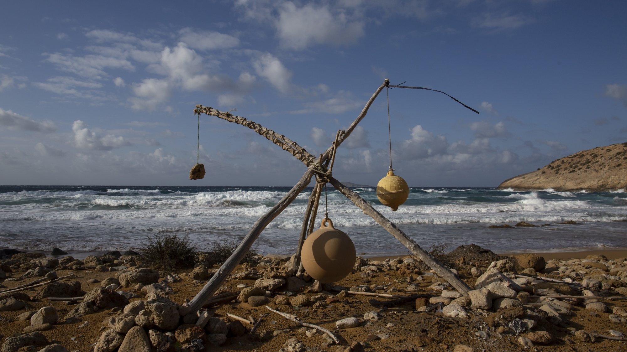 epa08856597 (26/29) Hanging stones and small buoys on pieces of wood, made by campers, stand at a beach on the island of Gavdos, Wednesday, January 29, 2020. As the island is a world-renowned summer destination for free campers. Many of them continue to live on beaches the rest of the year.  EPA/YANNIS KOLESIDIS