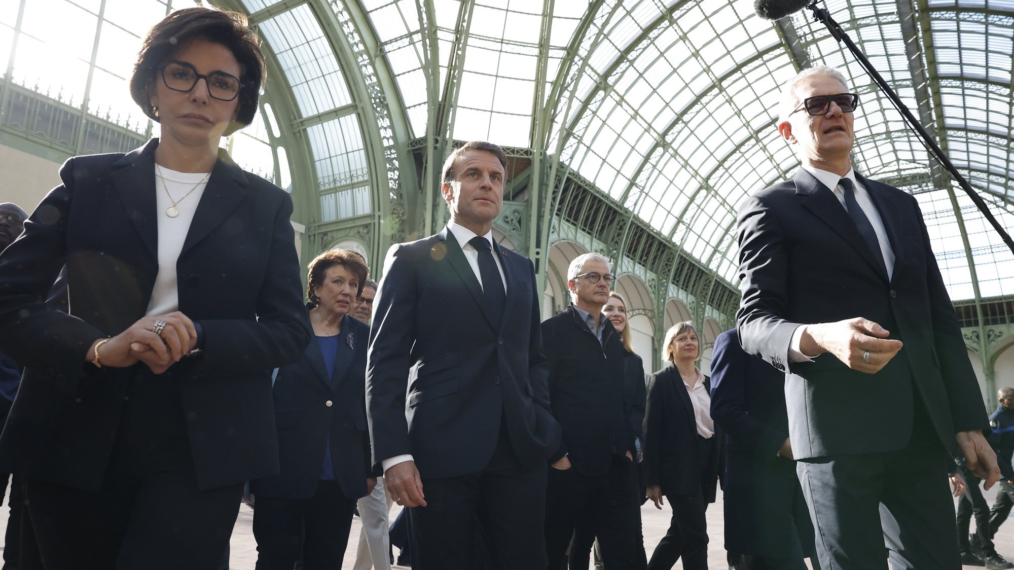 epa11279435 French President Emmanuel Macron (C) walks next to President of the Grand Palais Didier Fusillier (R) and  Minister of Culture of France Rachida Dati (L) during his visit at the Grand Palais 100 days ahead of the Paris 2024 Olympic Games in Paris, France, 15 April 2024. The 2024 Summer Olympics are held in Paris from 26 July to 11 August 2024, and the Grand Palais will host Fencing and Taekwondo.  EPA/YOAN VALAT / POOL