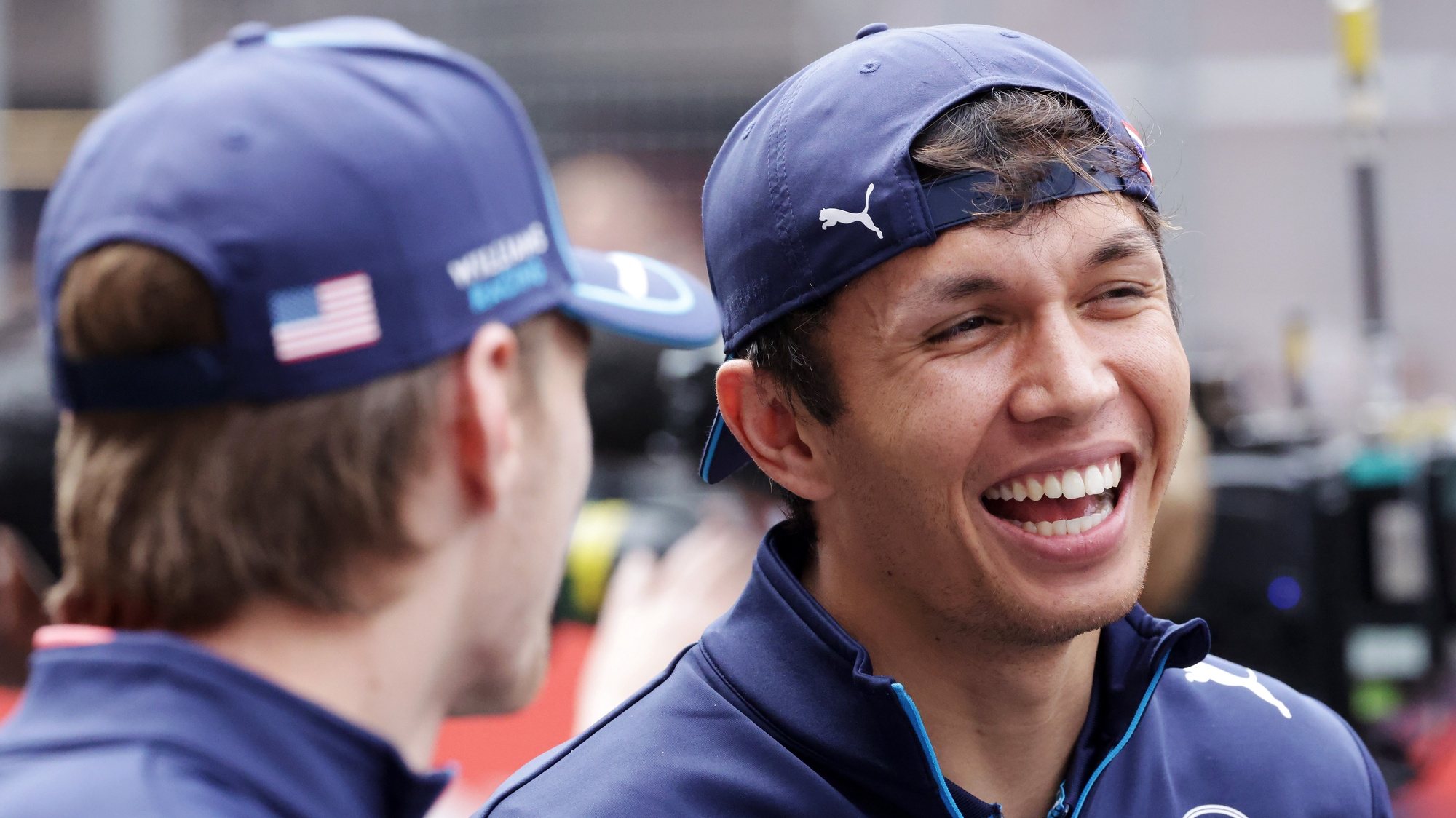 epa11291027 Williams driver Alexander Albon of Thailand (R) and teammate Logan Sargeant of the USA during a drivers parade ahead of the Formula One Chinese Grand Prix, in Shanghai, China, 21 April 2024. The 2024 Formula 1 Chinese Grand Prix is held at the Shanghai International Circuit racetrack on 21 April after a five-year hiatus.  EPA/ALEX PLAVEVSKI