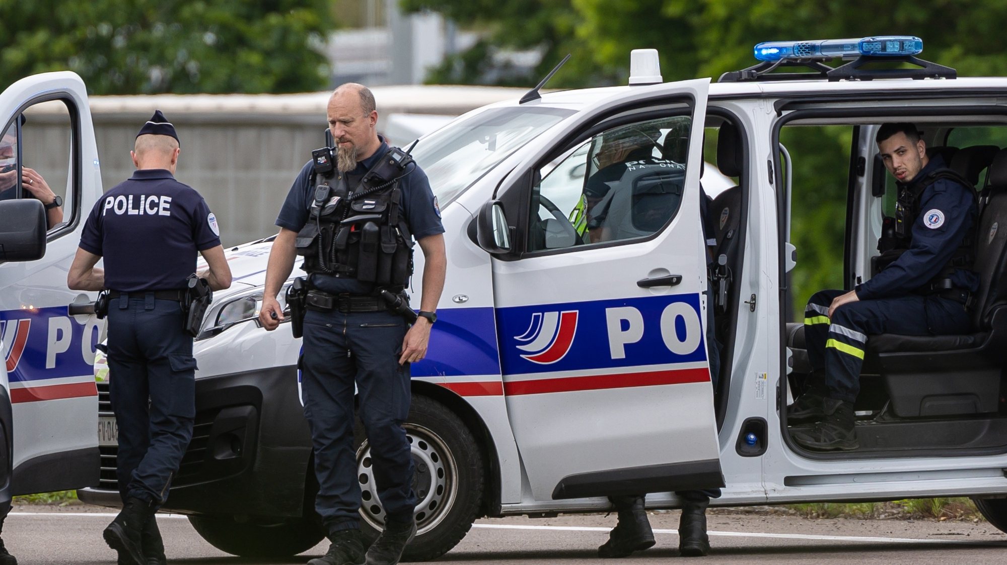 epa11339833 French policemen stand guard at the toll station of Incarville, near Rouen, in the North of France, where gunmen ambushed a prison van on 14 May 2024, killing two prison guards and helping a prisoner to escape. Three other prison guards were severely wounded, according to Justice minister Eric Dupond-Moretti. A major police manhunt has been launched to find the gunmen and the escaped prisoner,  identified as a 30-year-old drug dealer from northern France, according to the Paris prosecutor&#039;s office.  EPA/CHRISTOPHE PETIT TESSON