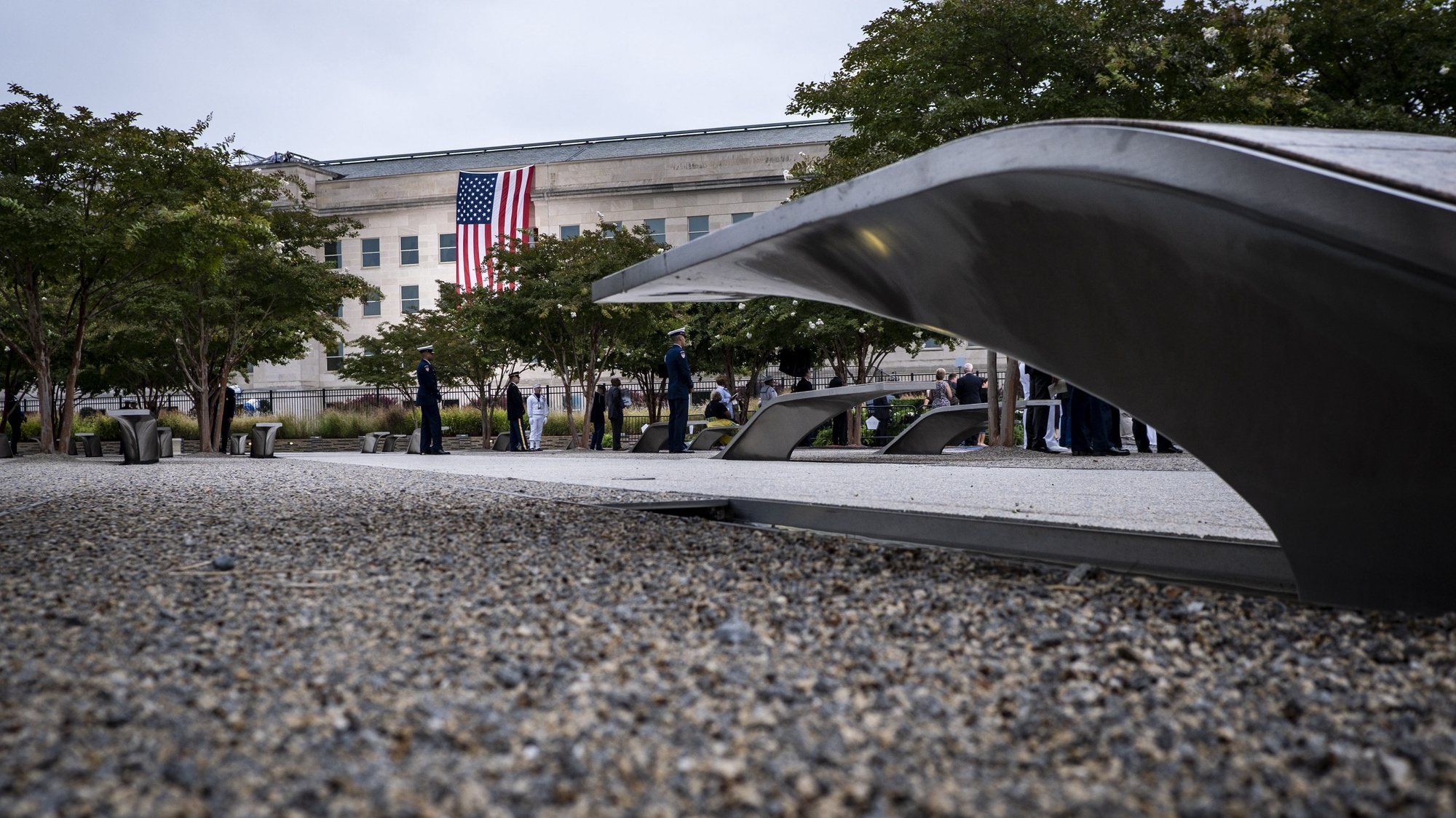 epa07835051 Military personnel at the Pentagon Memorial prepare for a remembrance ceremony of the 18th anniversary of the terrorist attacks on US soil, in Arlington, Virginia, USA, 11 September 2019. The ceremony commemorates the 184 people killed at the Pentagon when terrorists crashed an airliner into the building on 11 September 2001.  EPA/PETE MAROVICH