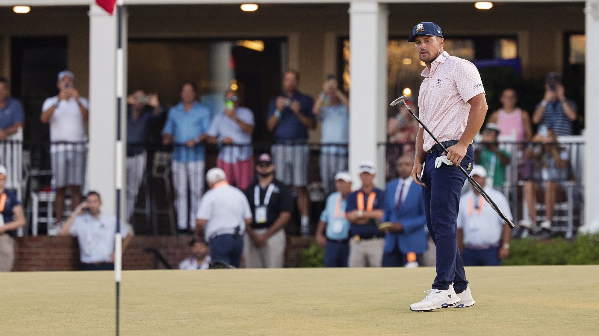 epa11414125 Bryson DeChambeau of the US reacts to a missed shot on the 18th green during the third round of the 2024 US Open golf tournament at Pinehurst No. 2 course in Pinehurst, North Carolina, USA, 15 June 2024.  EPA/ERIK S. LESSER