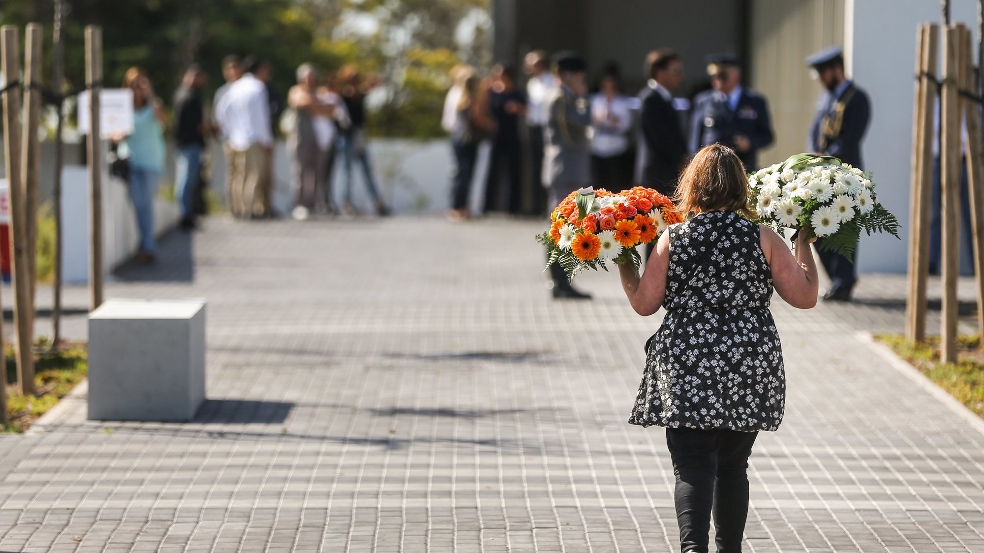 epa06157958 People gathered during the funeral ceremonies of the Portuguese victims of the terrorist attack of Barcelona, at the Cascais Funeral Center in Cascais, Portugal, 23 August 2017. The two Portuguese citizens, a 74-year-old woman, and her 20-year-old granddaughter died on the La Rambla boulevard in Barcelona, on 17 August, hit by a van that, during a route of about 600 meters, was ramming the passersby, killing 13 peole and leaving more than 130 injured.  EPA/MARIO CRUZ