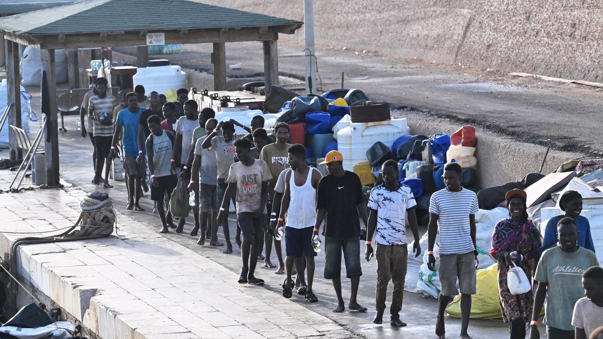 epa10867466 Migrants arrive at &#039;Molo Favarolo&#039; in Lampedusa, southern Italy, 18 September 2023. Migrants traveling on a small boat were rescued by the Coast Guard. The group, after the health triage, will be transferred to the hotspot where, at the moment, there are 1,104 people.  Italian Deputy Premier and Foreign Minister Antonio Tajani on 15 September called for the intervention of the United Nations in response to the significant increase in the arrival of migrants and refugees by sea to Italy in recent days.  EPA/CIRO FUSCO