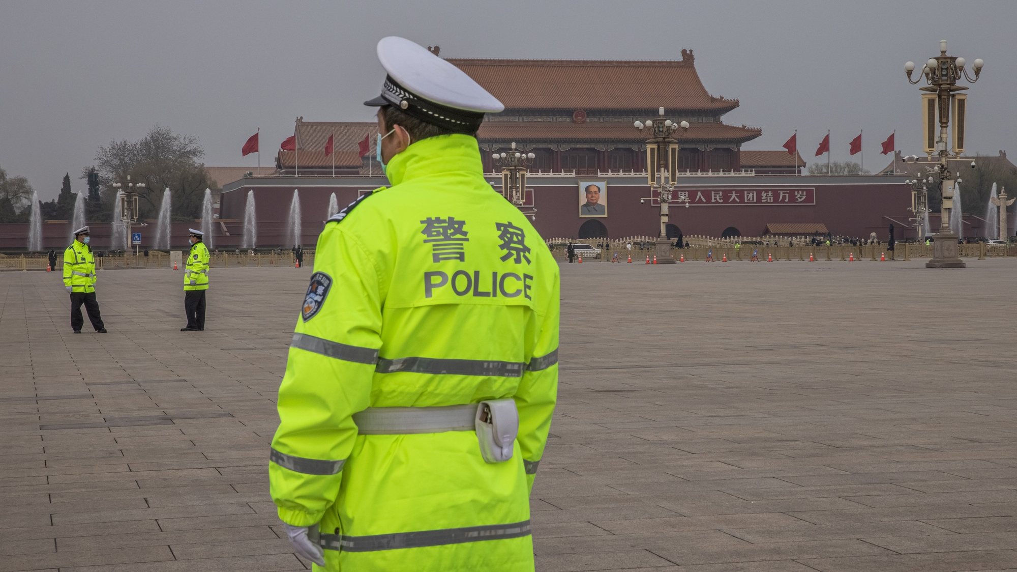 epa09067267 Police officers stand guard at Tiananmen Square prior to the closing session of the National People’s Congress (NPC) at the Great Hall of the People, in Beijing, China, 11 March 2021. China held two major annual political meetings, The National People’s Congress (NPC) and the Chinese People&#039;s Political Consultative Conference (CPPCC) which run alongside and together known as &#039;Lianghui&#039; or &#039;Two Sessions&#039;.  EPA/ROMAN PILIPEY